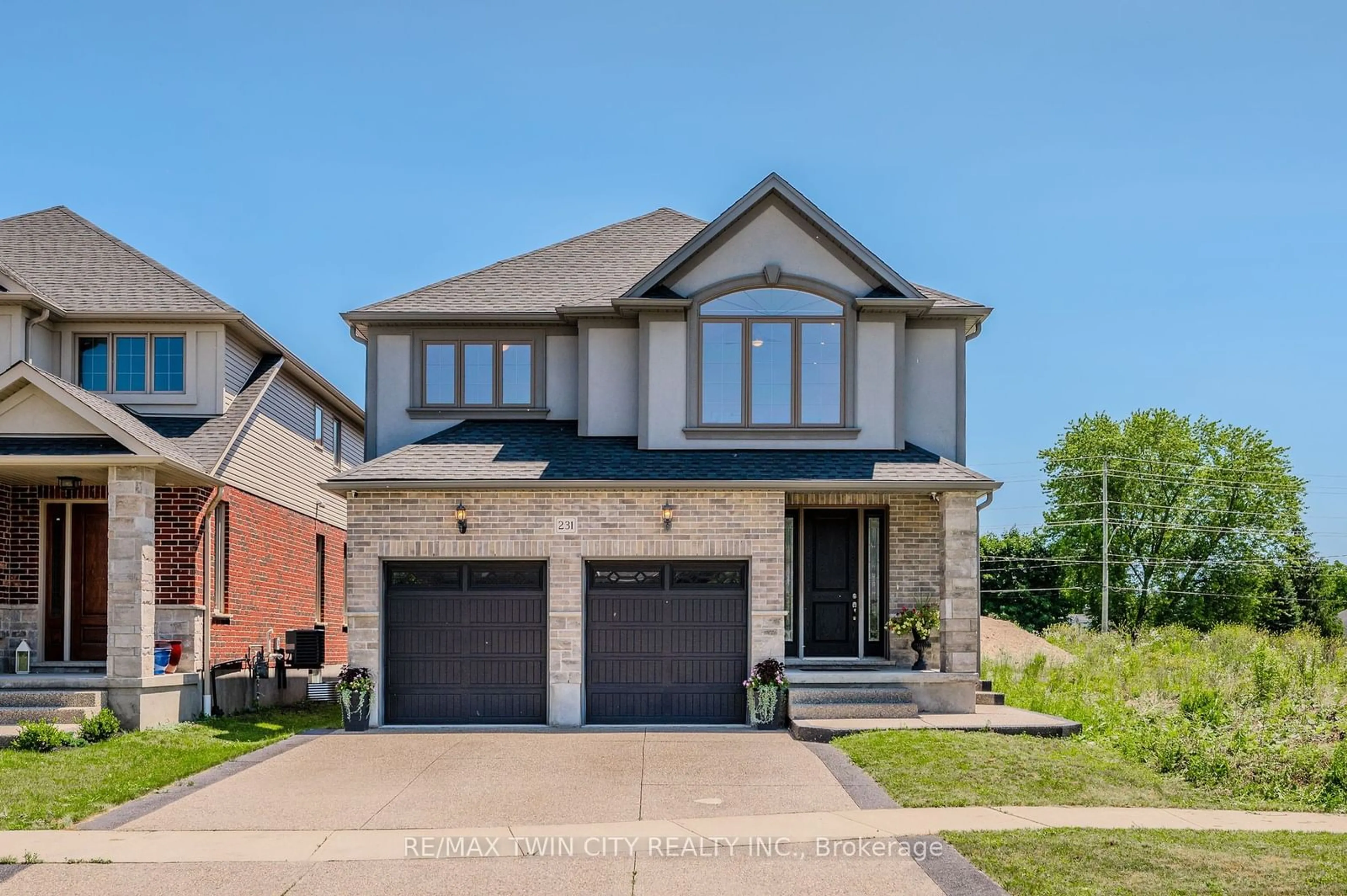 Home with brick exterior material for 231 Carriage Way, Waterloo Ontario N2K 0C6