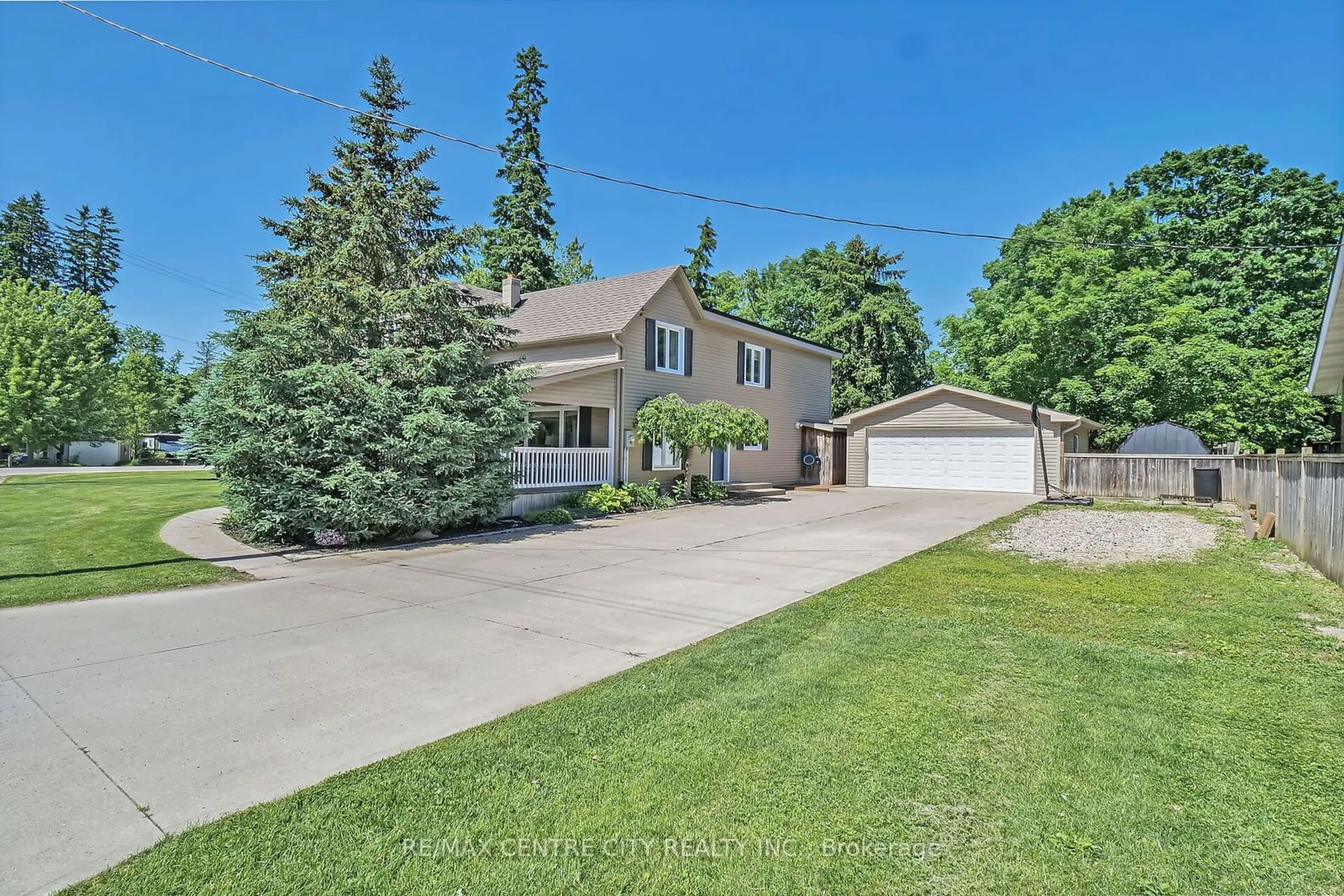 Frontside or backside of a home for 24392 Poplar Hill Rd, Middlesex Centre Ontario N0M 2A0