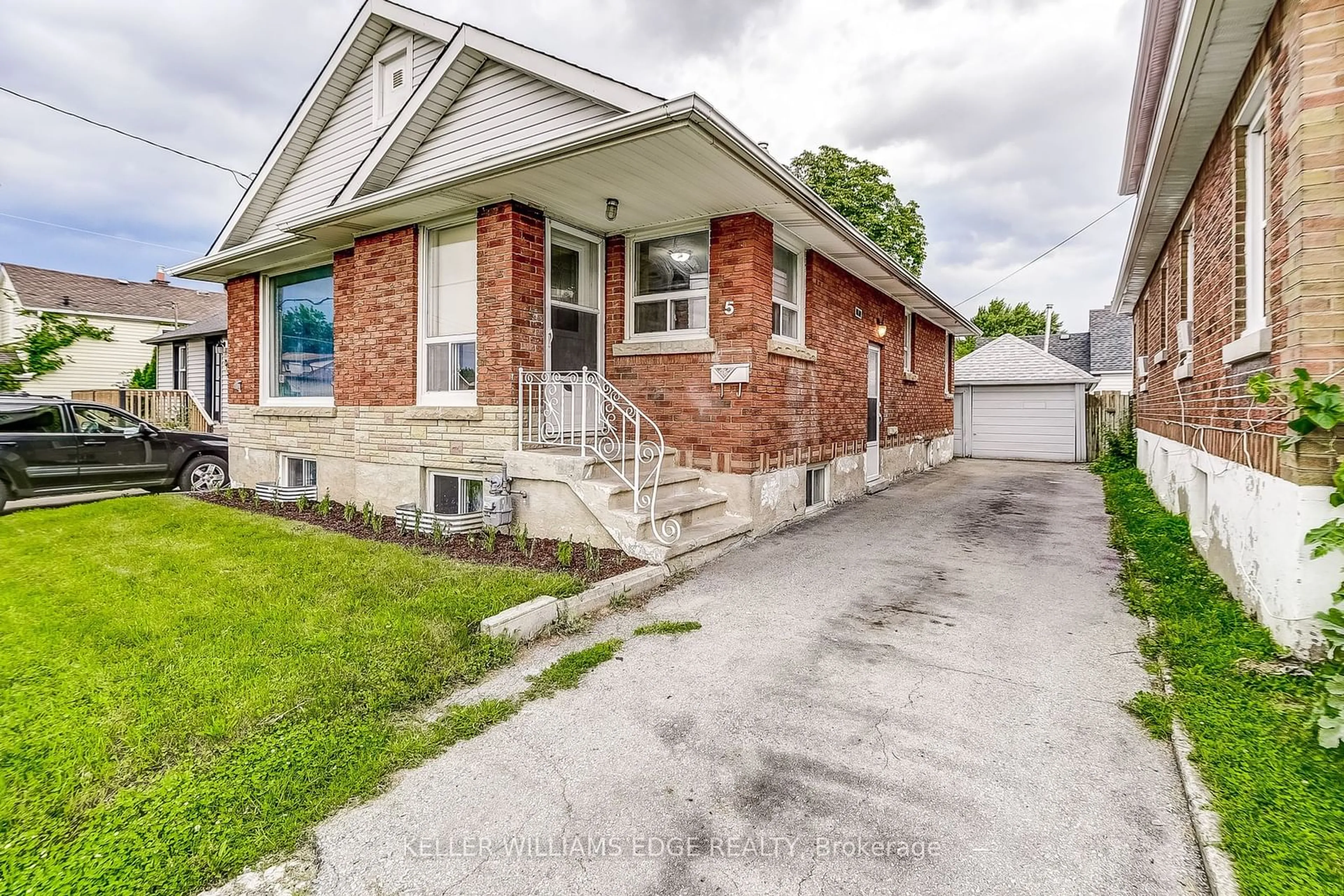 Frontside or backside of a home for 5 Bartlett St, St. Catharines Ontario L2M 5K5