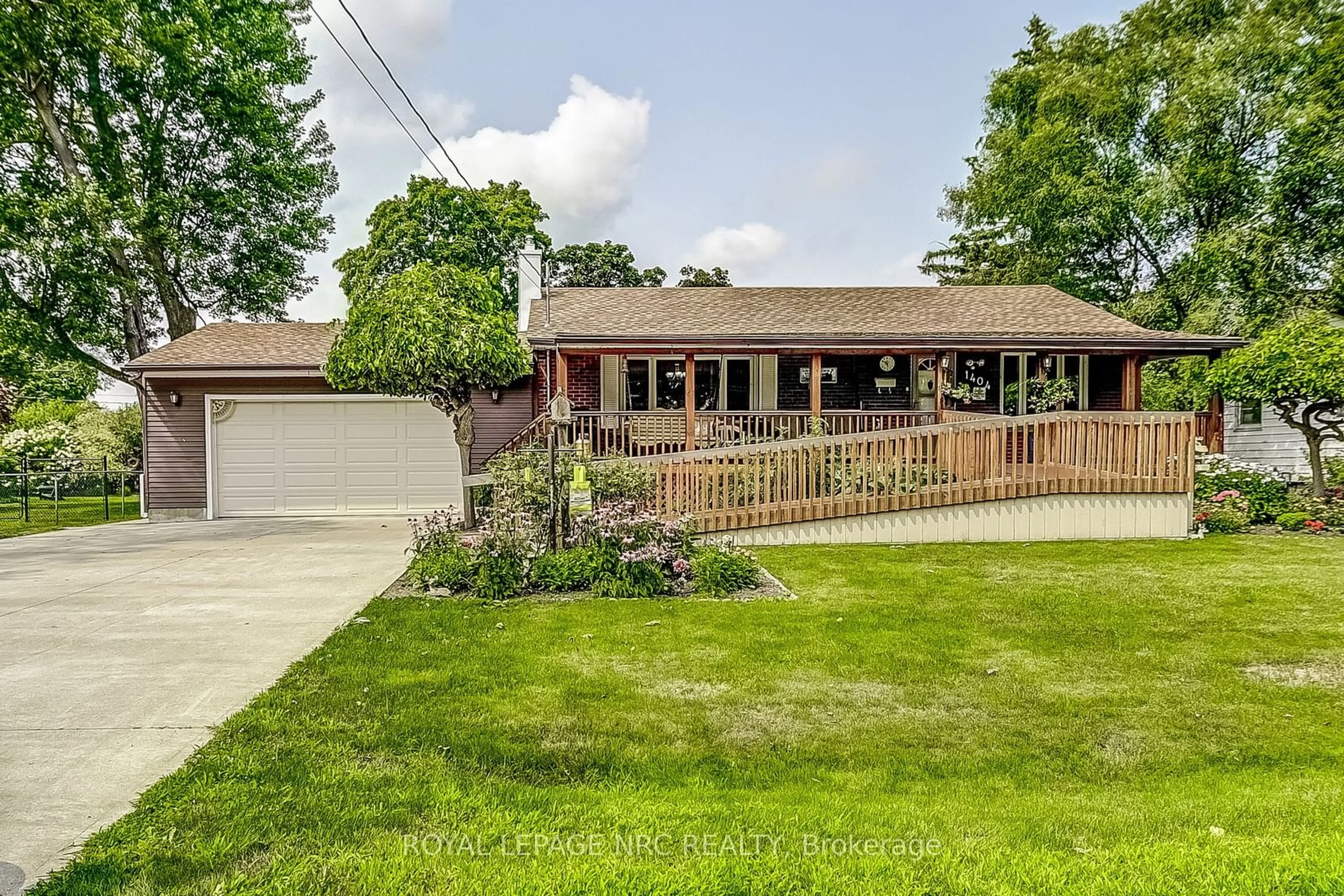 Frontside or backside of a home, the fenced backyard for 1404 Orchard Ave, Fort Erie Ontario L2A 3E6