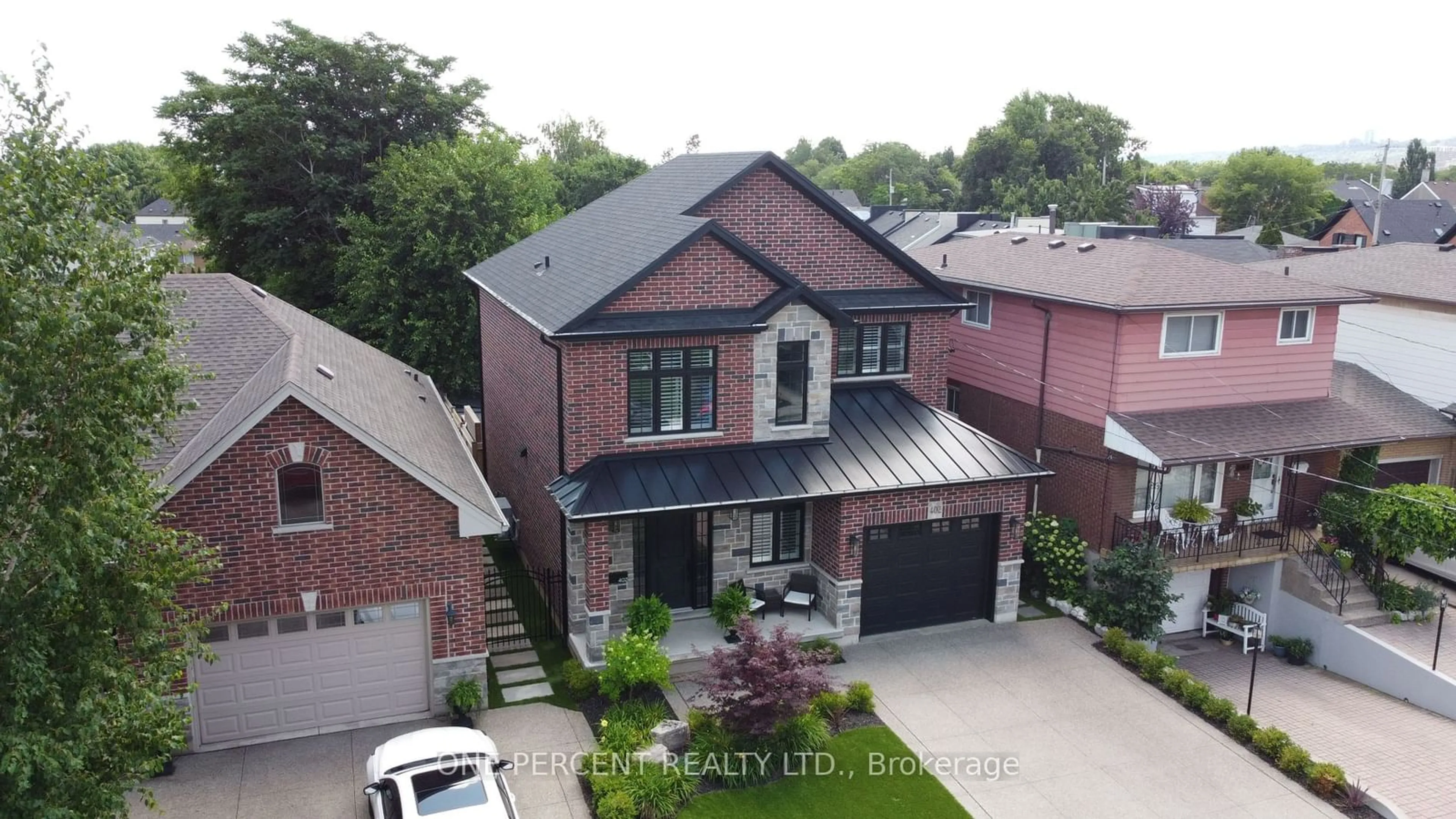 Home with brick exterior material for 402 Bay St, Hamilton Ontario L8L 1N1