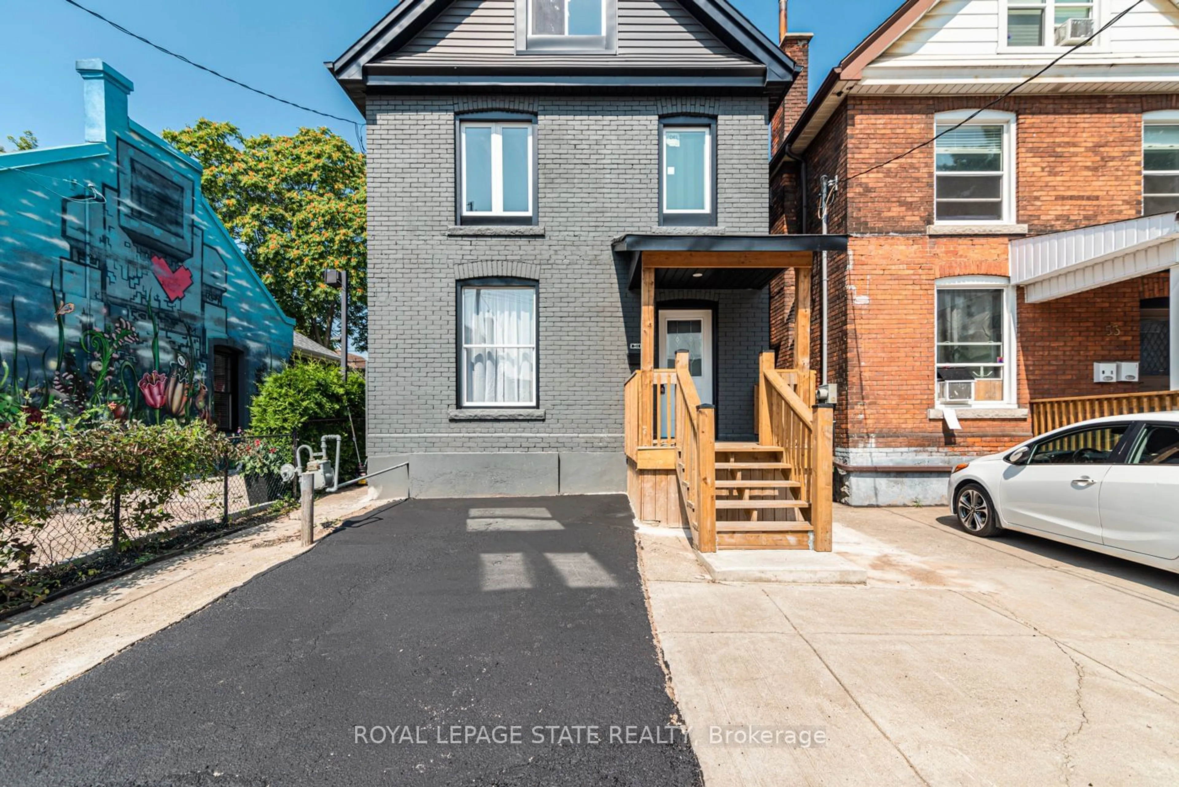 Frontside or backside of a home for 51 William St, Hamilton Ontario L8L 5T6