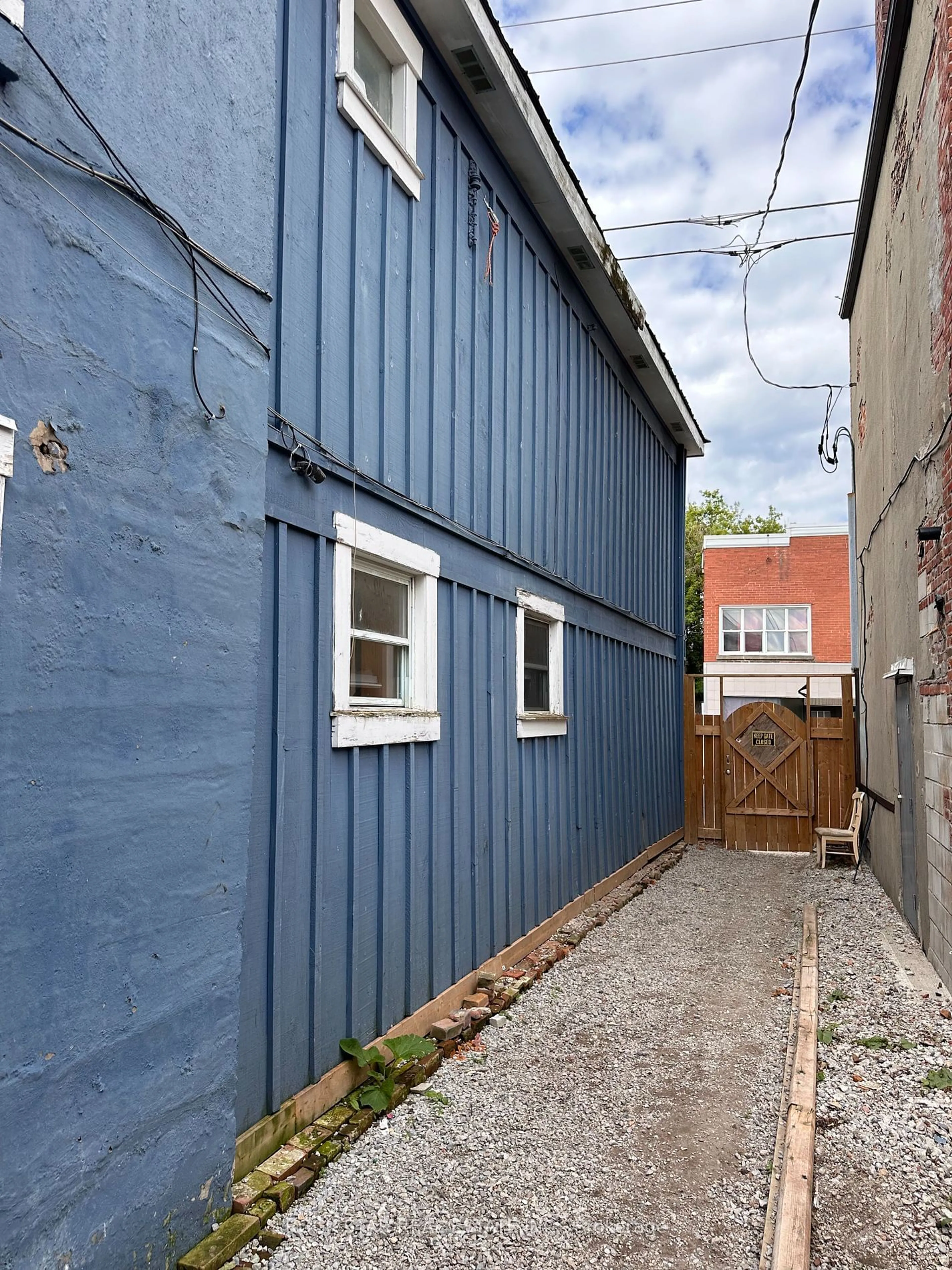 Frontside or backside of a home, the fenced backyard for 13 Kent St, Norfolk Ontario N3Y 1W4