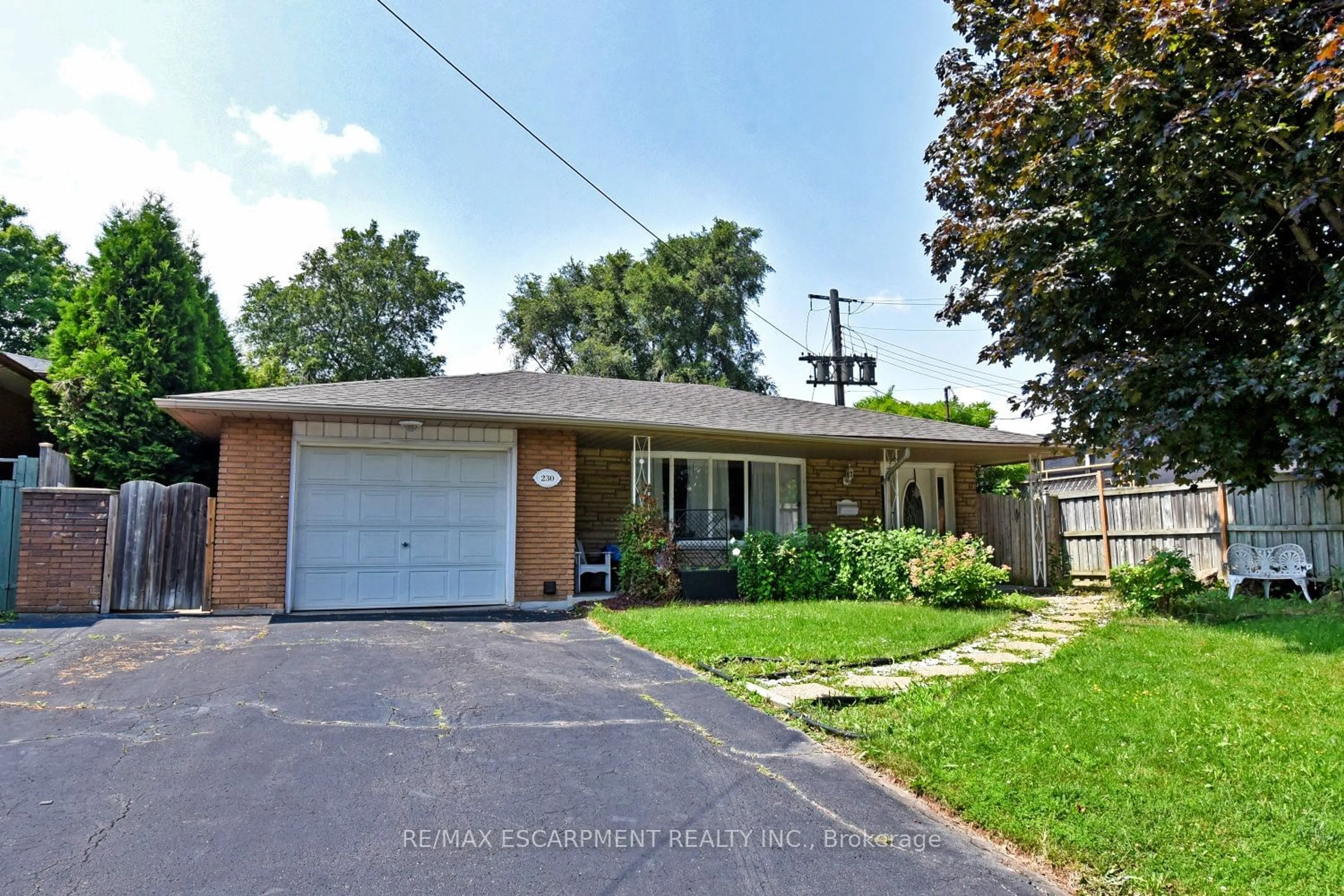 Frontside or backside of a home for 230 West 15th St, Hamilton Ontario L9C 4B5