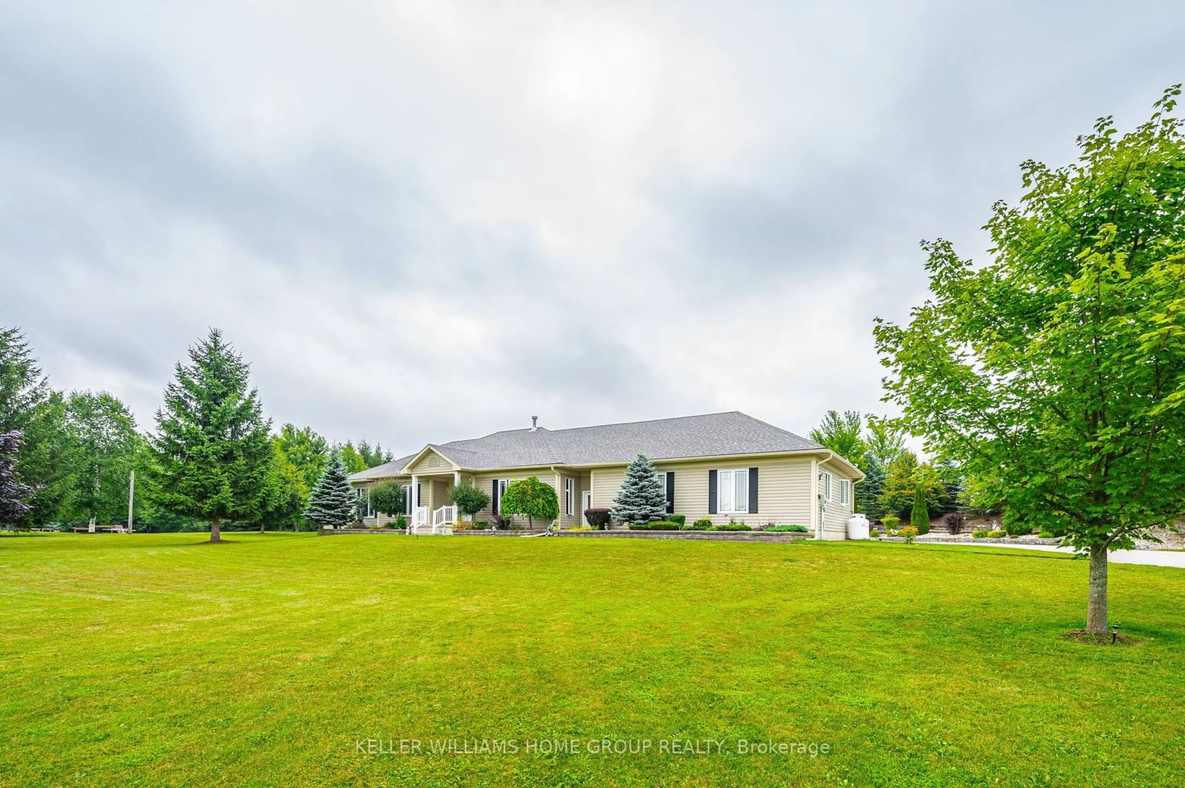 Frontside or backside of a home, the fenced backyard for 27 Highland Rd, Minto Ontario N0G 1M0