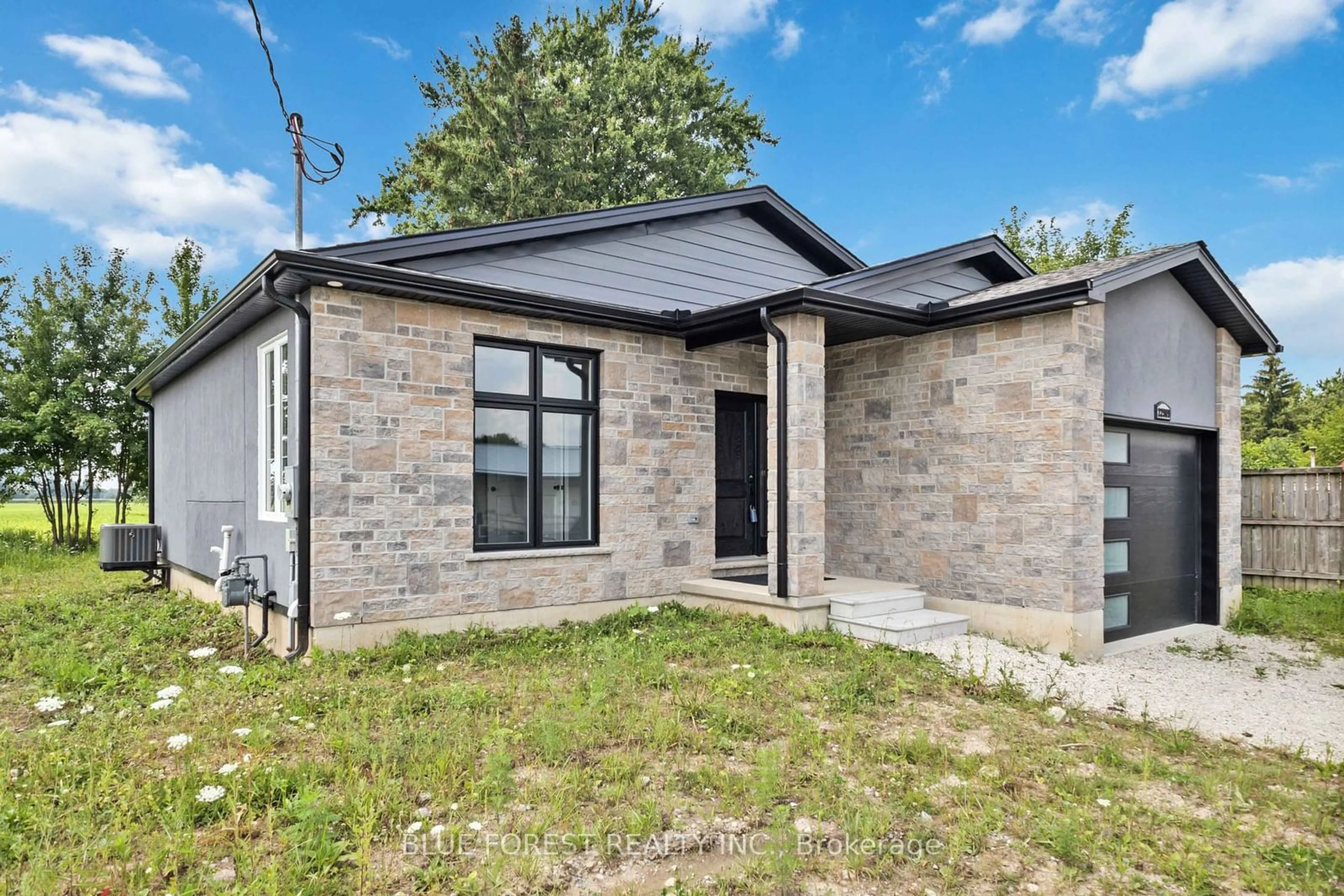 Home with brick exterior material for 22909 Highbury Ave, Middlesex Centre Ontario N0M 2A0