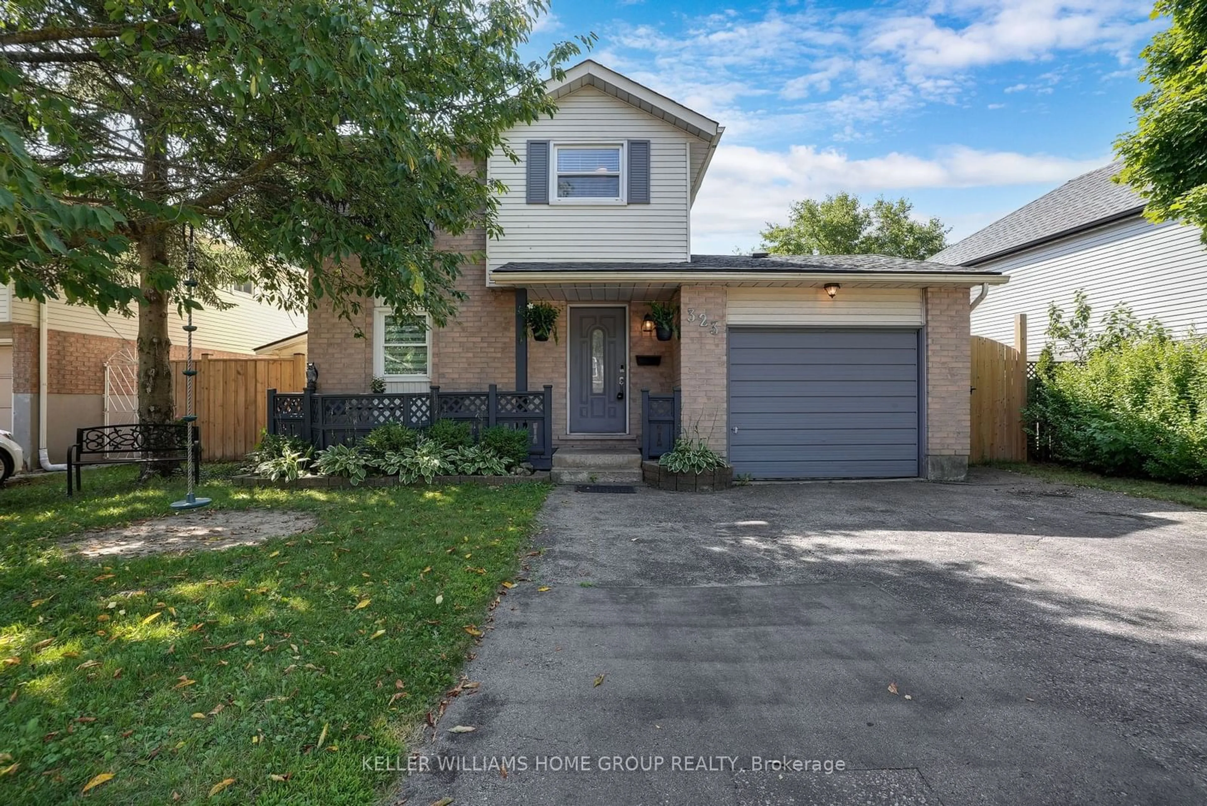 Frontside or backside of a home, the fenced backyard for 323 Sekura St, Cambridge Ontario N1R 7W2