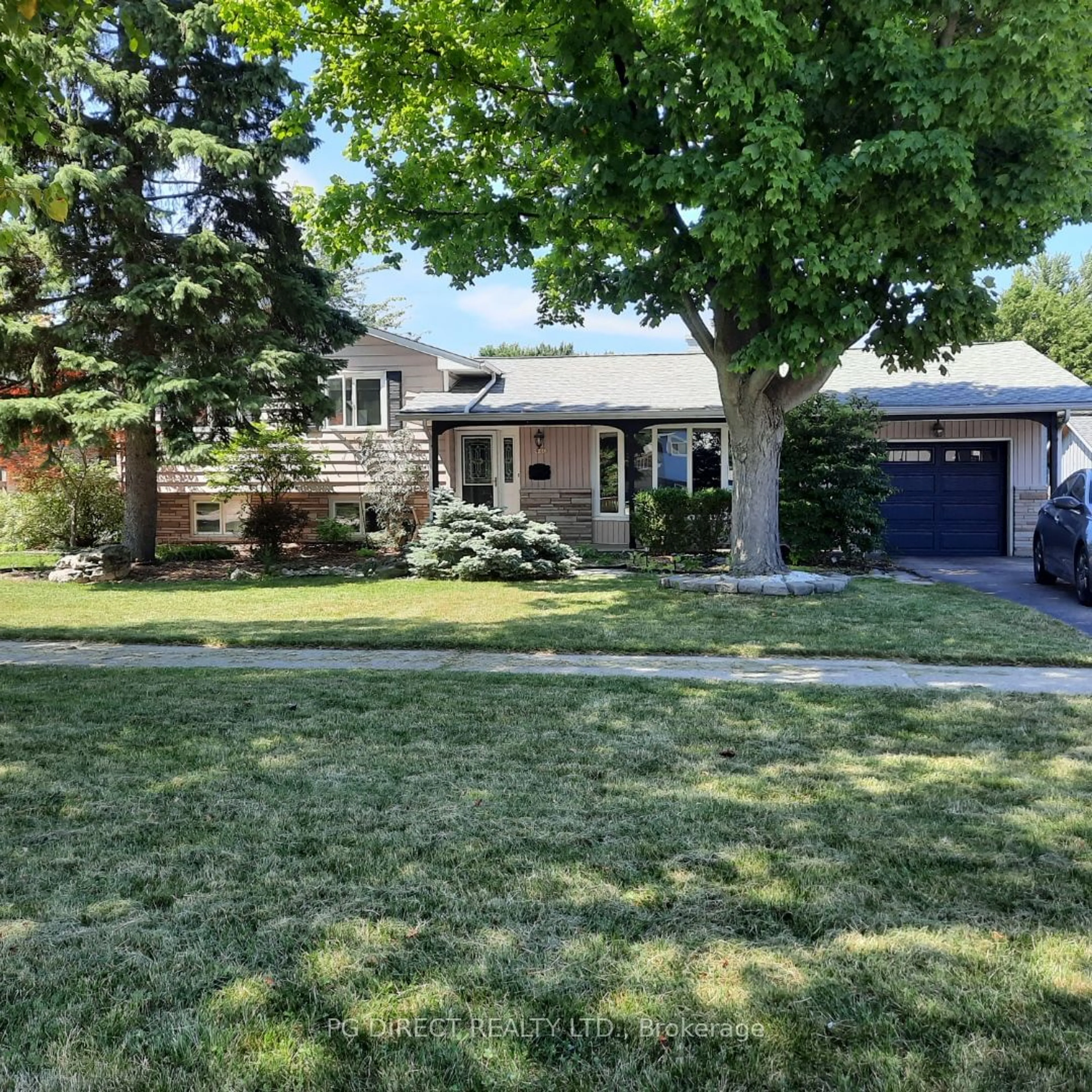 Frontside or backside of a home, the fenced backyard for 940 Cathcart Blvd, Sarnia Ontario N7V 2N9