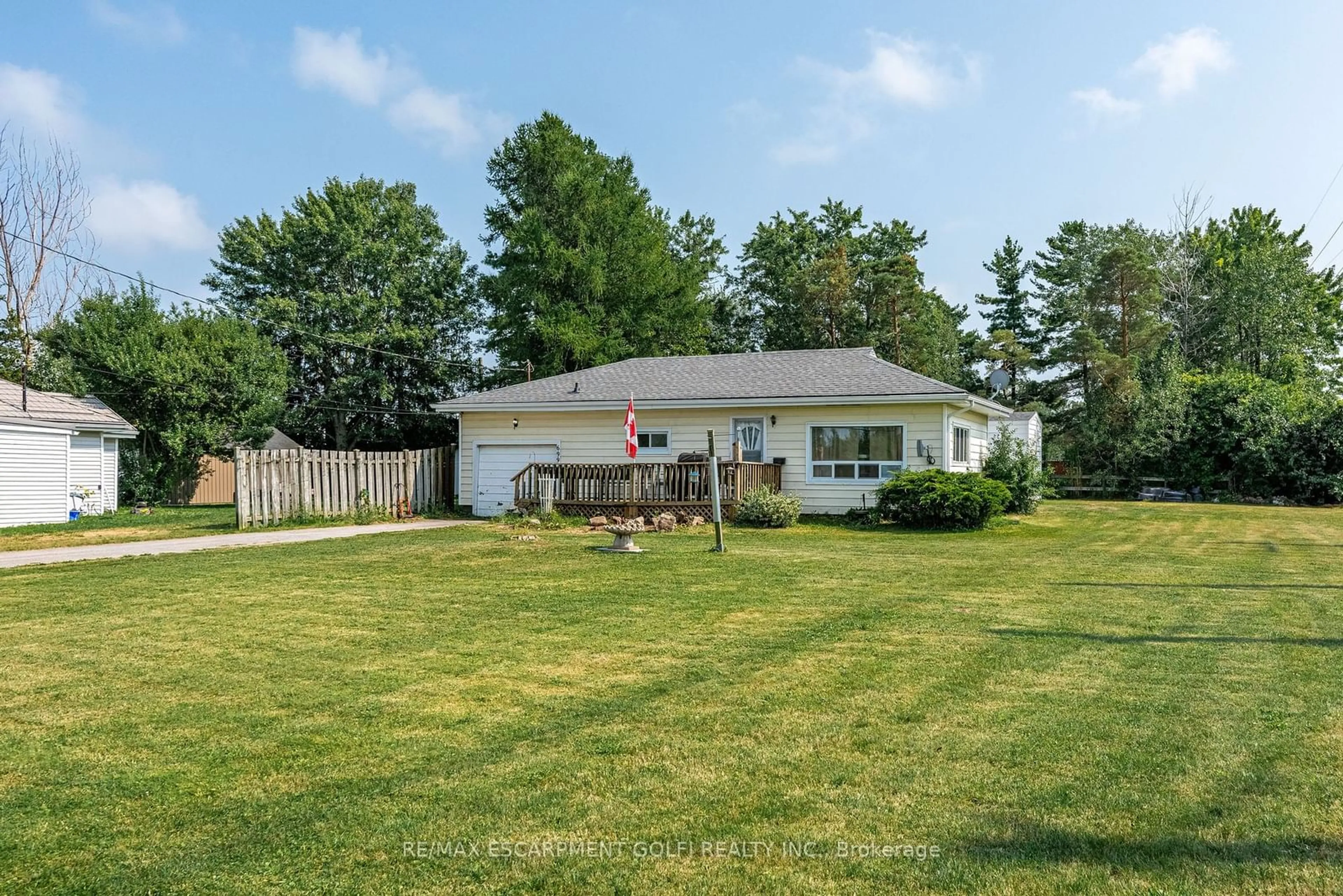 Frontside or backside of a home, the fenced backyard for 699 Gilmore Rd, Fort Erie Ontario L2A 5M4