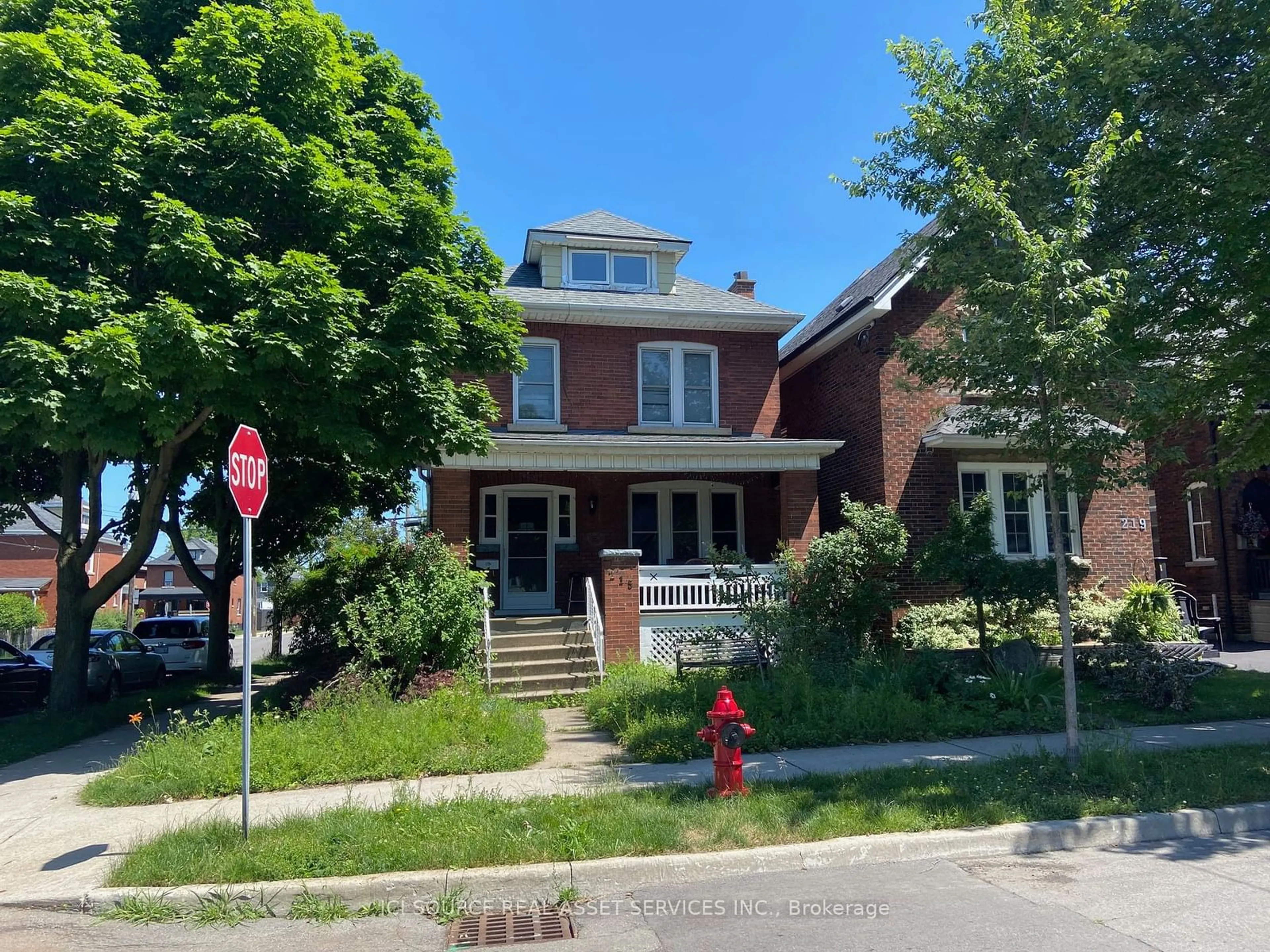 Frontside or backside of a home for 215 London St, Hamilton Ontario L8K 2H1