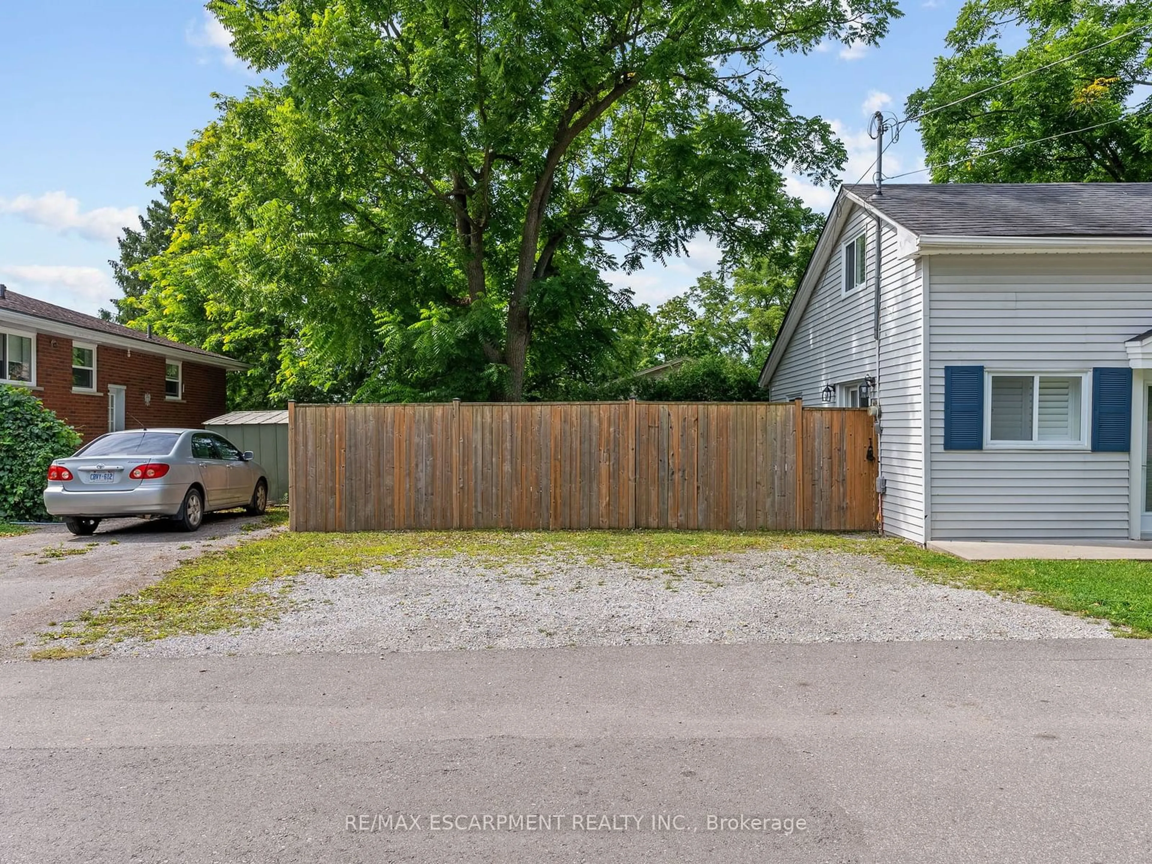 Frontside or backside of a home, the fenced backyard for 149 Park Lane, Haldimand Ontario N3W 1B2