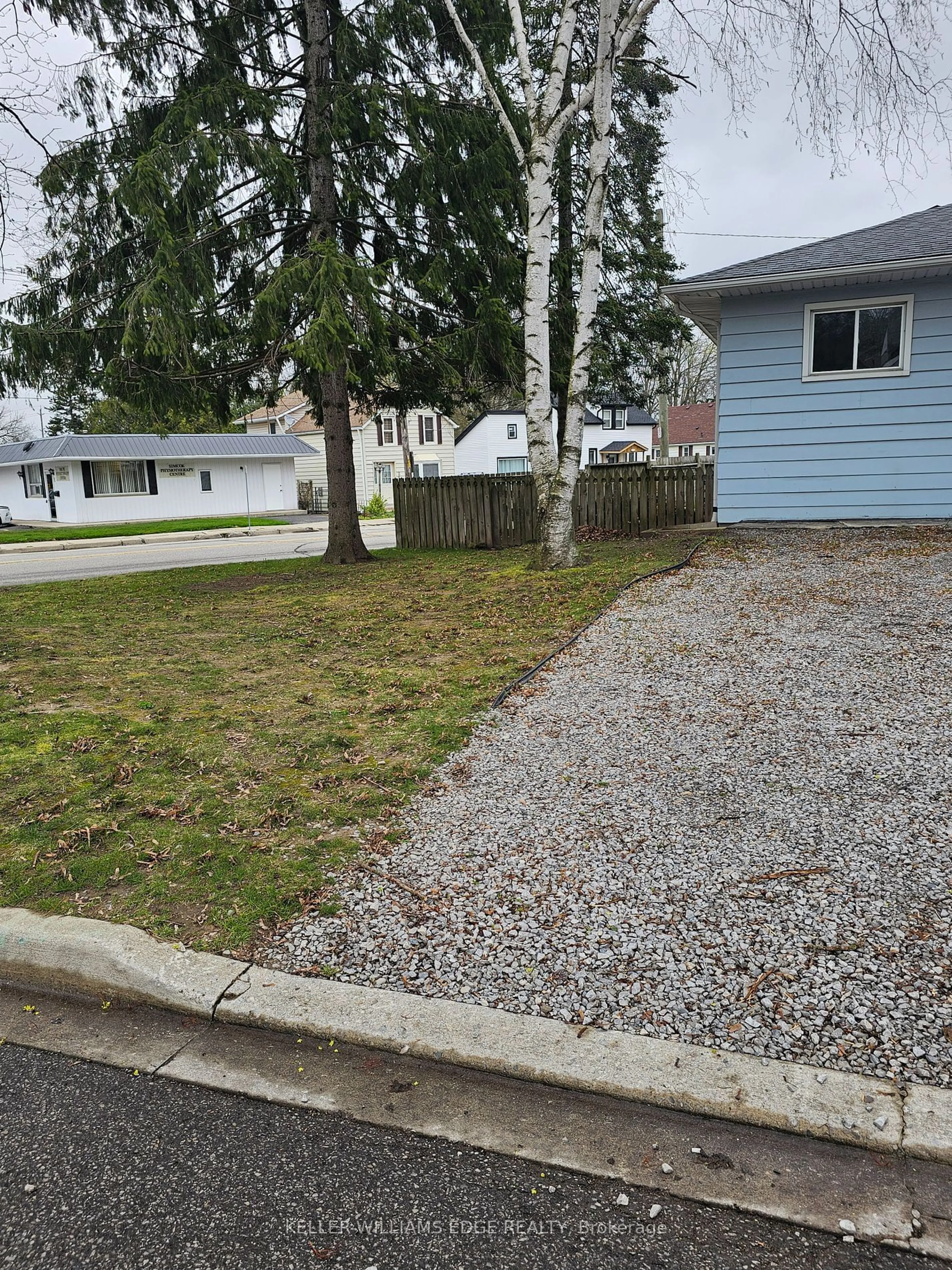 Frontside or backside of a home, the fenced backyard for 171 King Lane, Norfolk Ontario N3Y 4A1