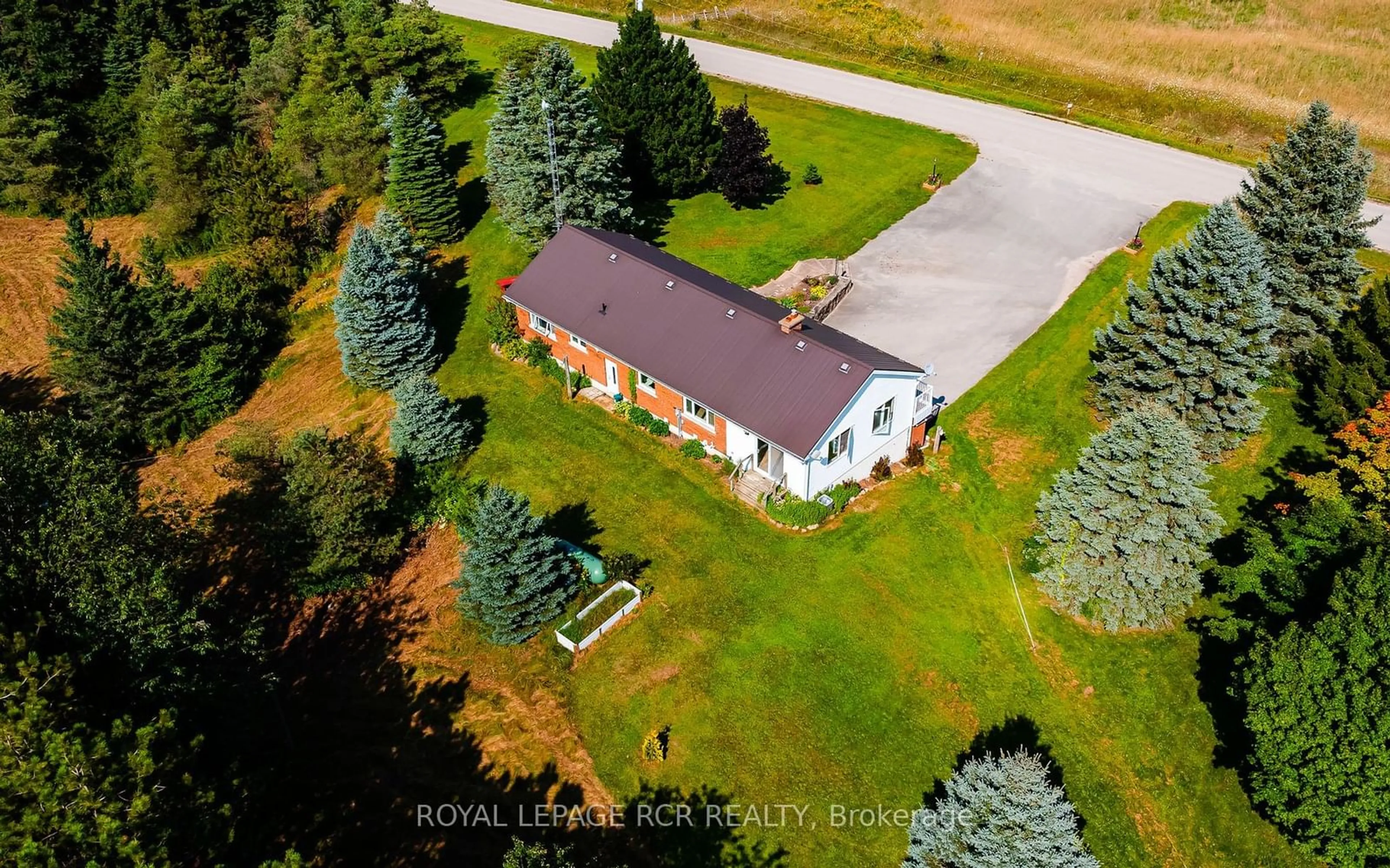 Frontside or backside of a home, the fenced backyard for 676400 Centre Rd, Mulmur Ontario L9V 0E1