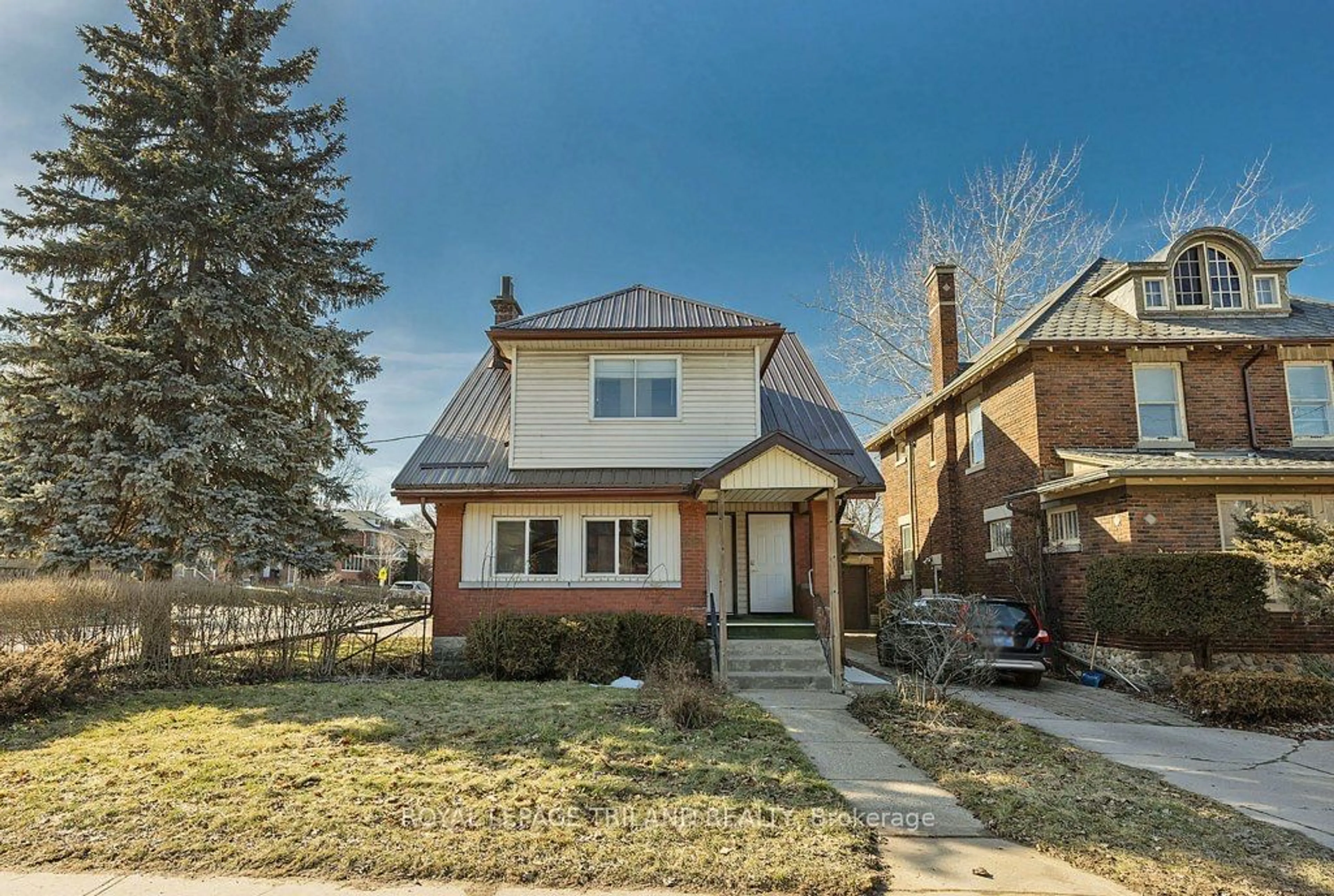 Frontside or backside of a home for 241 Ridout St, London Ontario N6C 3Y3