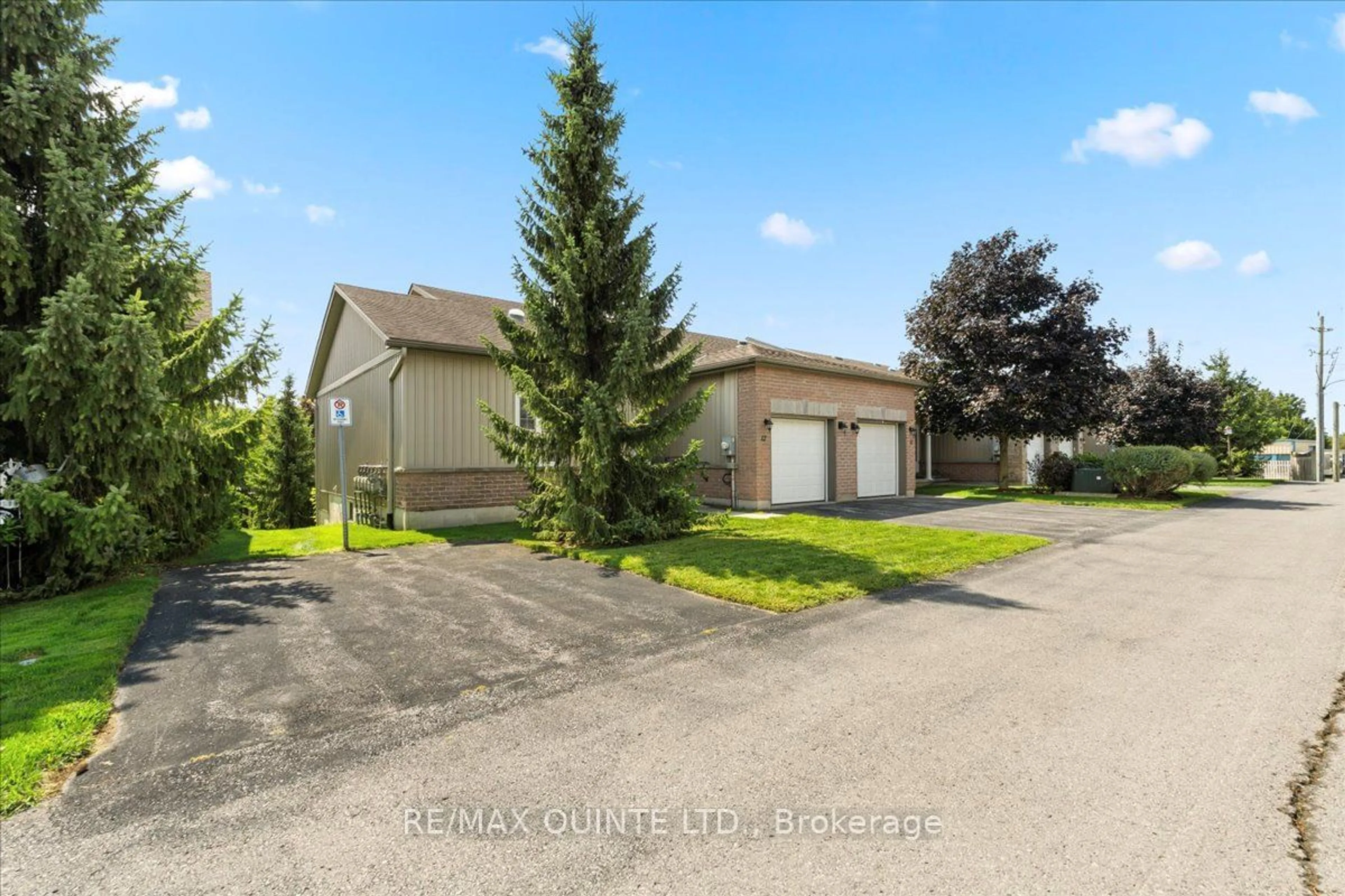 A pic from exterior of the house or condo, the fenced backyard for 1 Rosemary Crt #12, Prince Edward County Ontario K0K 2T0