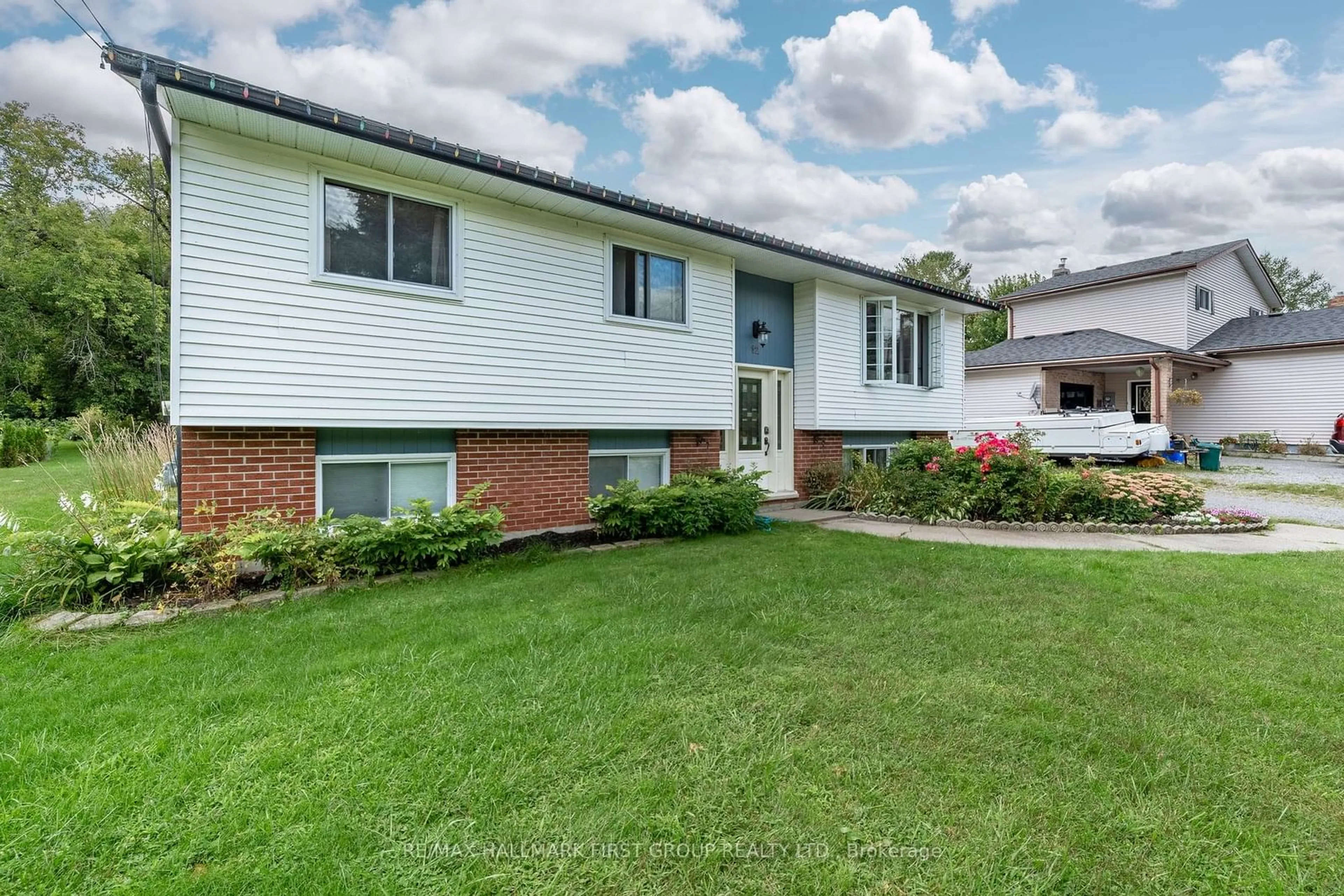 Frontside or backside of a home, the fenced backyard for 12 BALDWIN St, Brighton Ontario K0K 1H0