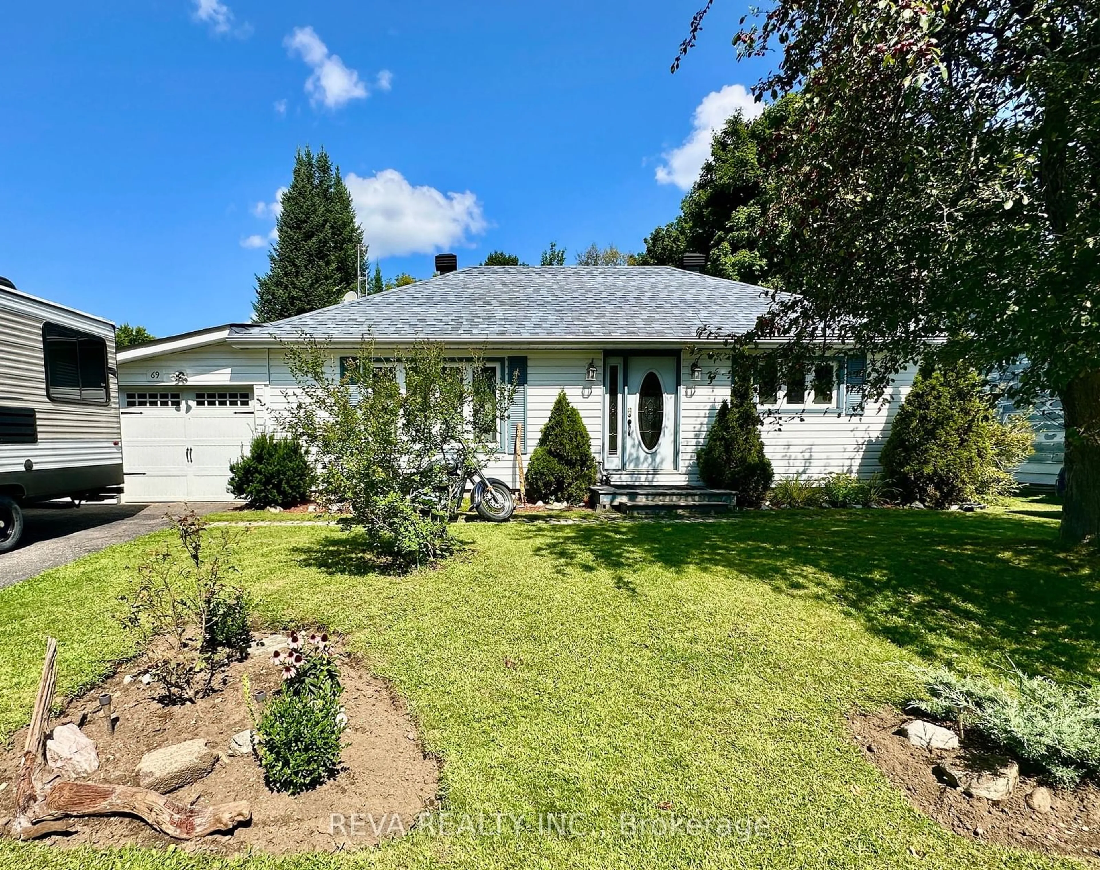 Frontside or backside of a home, the fenced backyard for 69 Johnston Cres, Bancroft Ontario K0L 1C0