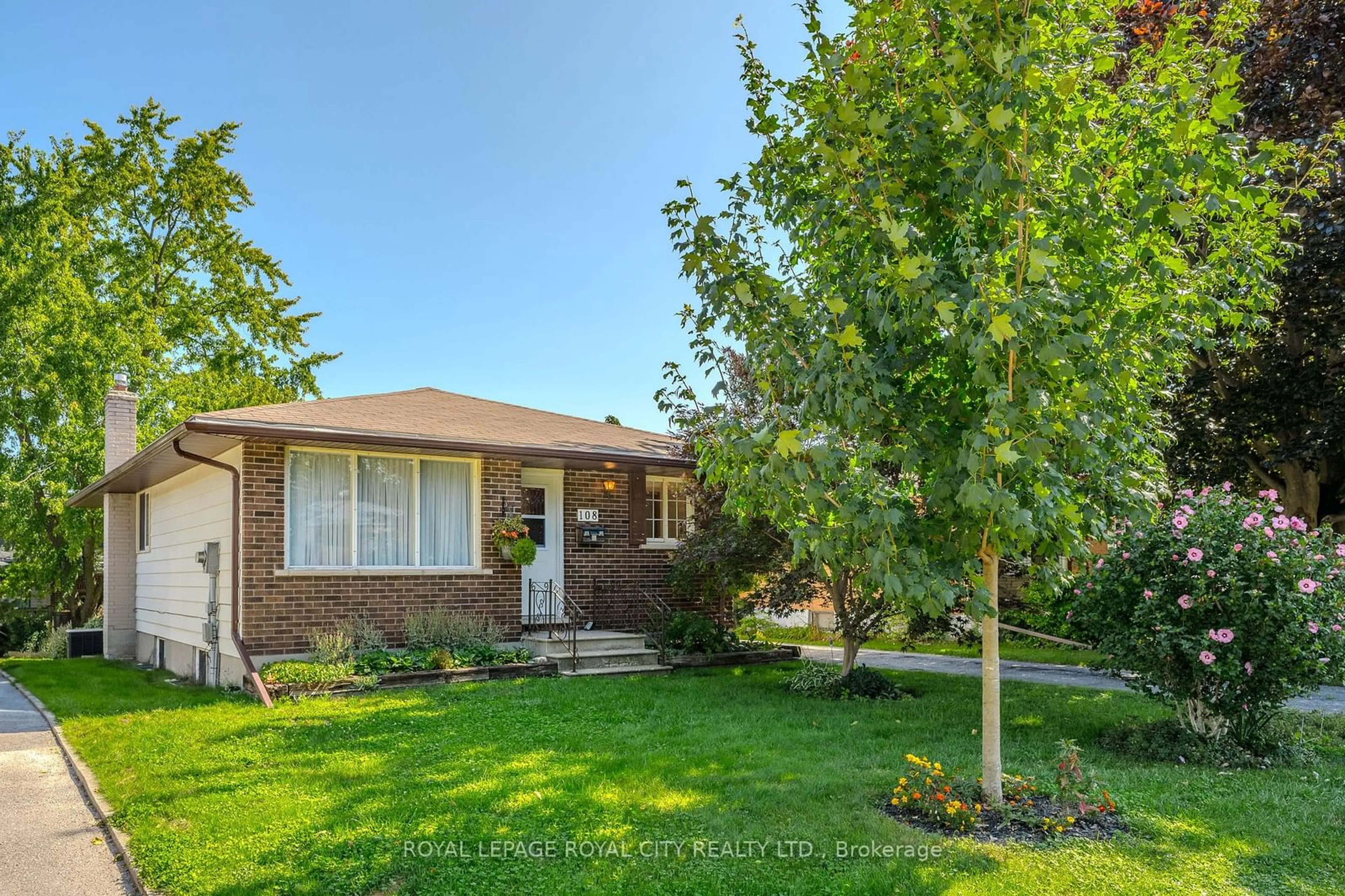 A pic from exterior of the house or condo, the fenced backyard for 108 Brant Ave, Guelph Ontario N1E 1G3