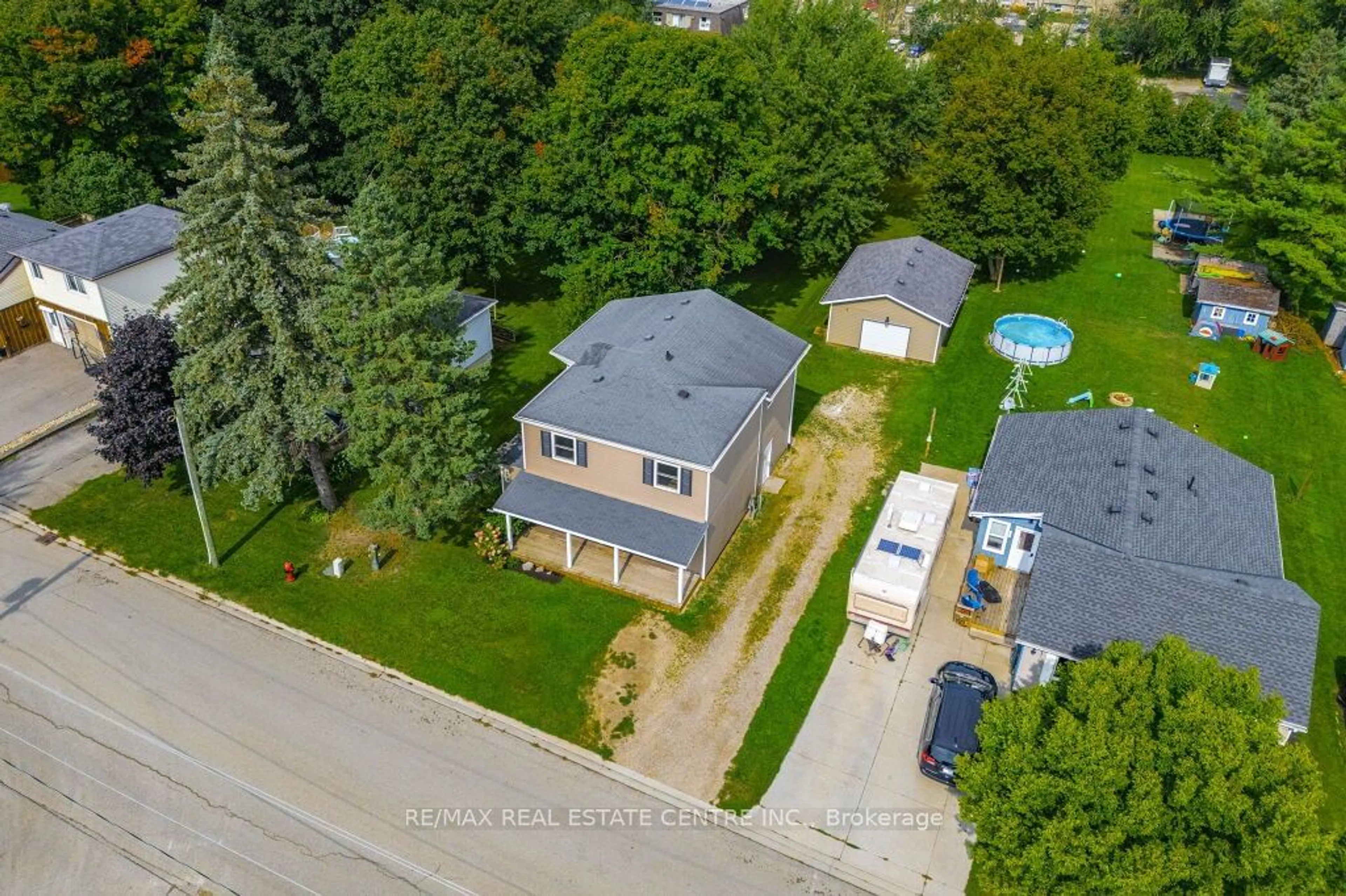 Frontside or backside of a home, the fenced backyard for 353 Wellington St, Wellington North Ontario N0G 2L2