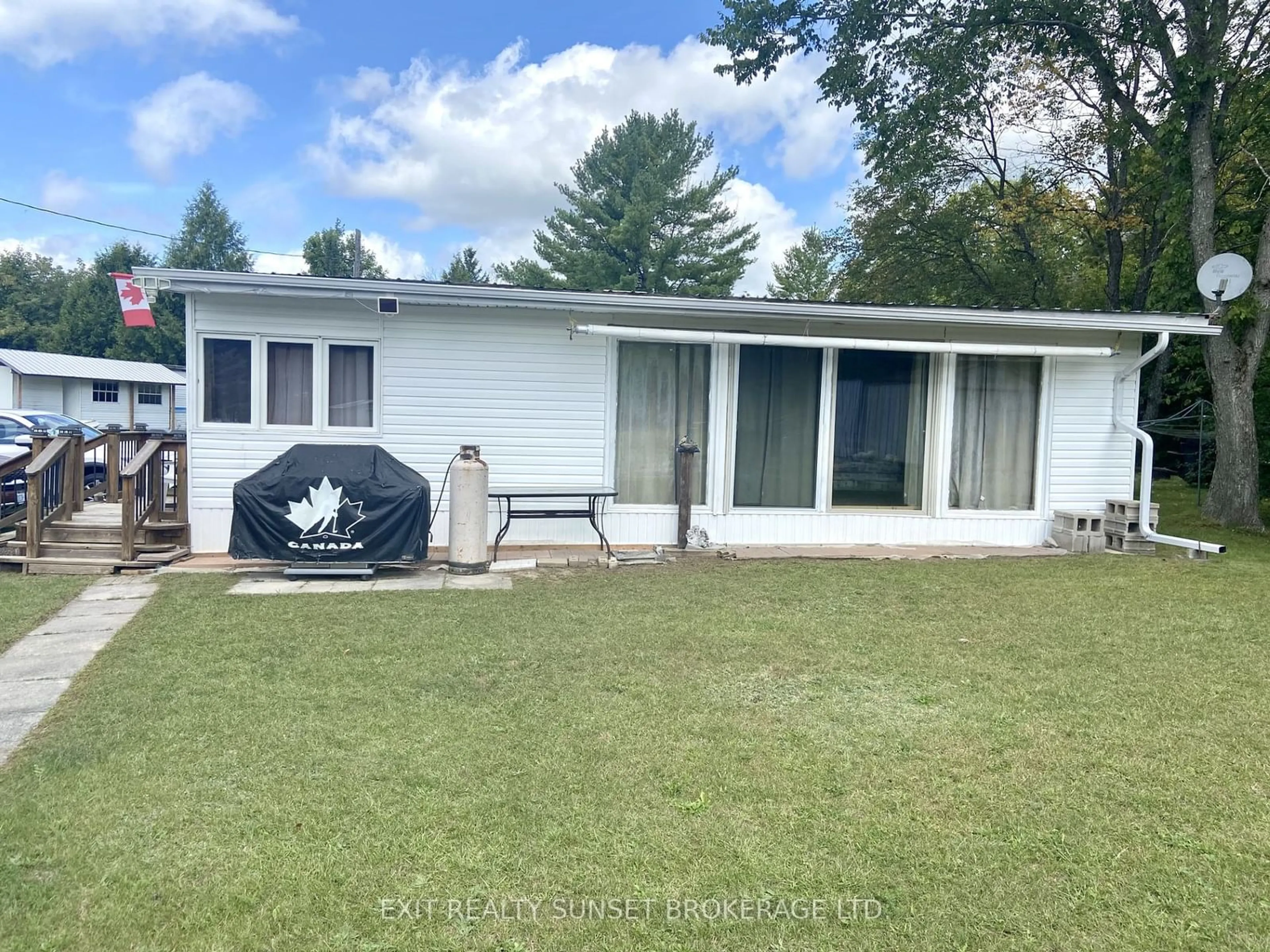 Frontside or backside of a home, the front or back of building for 1802 County Road 121 #133, Kawartha Lakes Ontario K0M 1N0