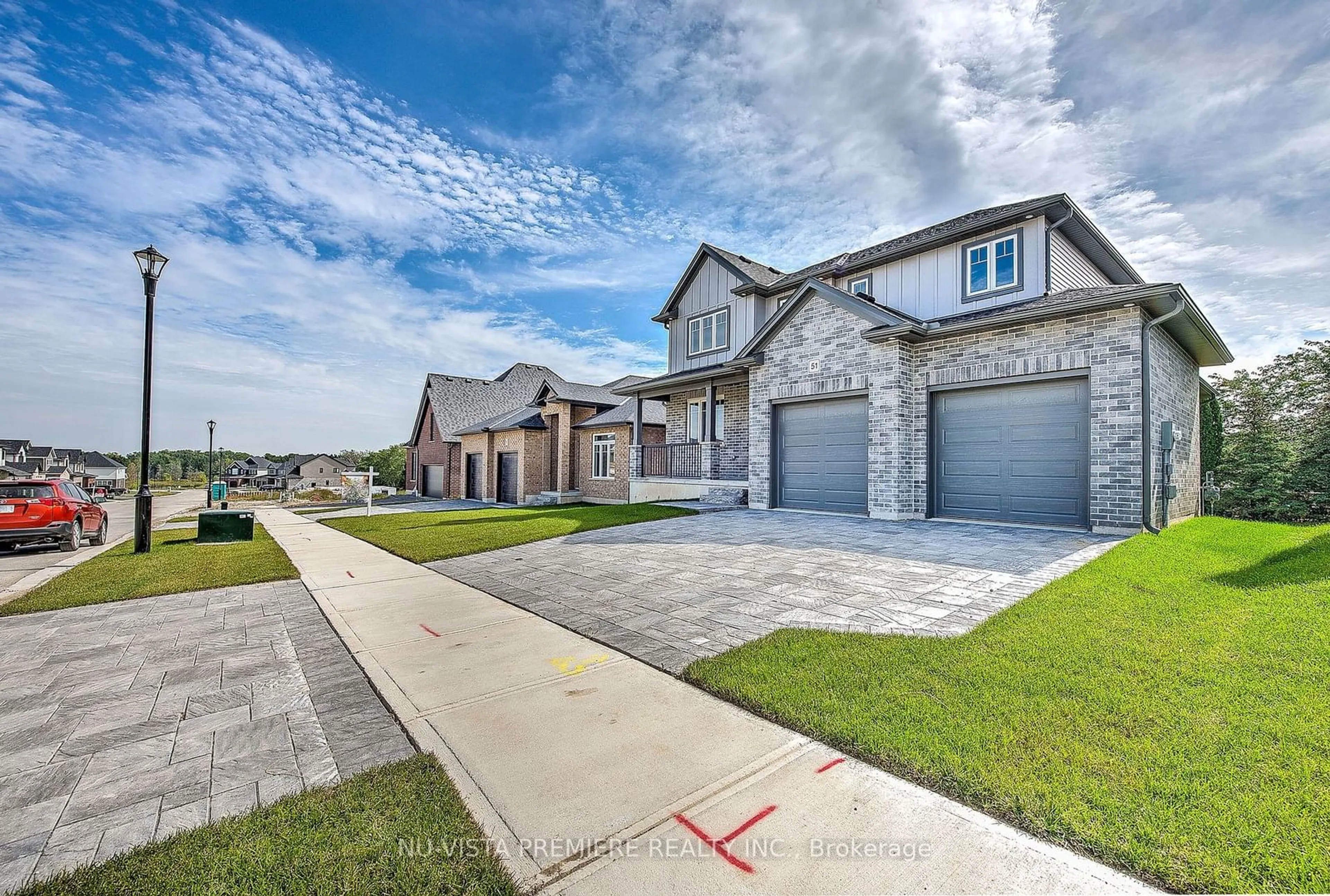 Frontside or backside of a home, the street view for 51 Basil Cres, Middlesex Centre Ontario N0M 2A0