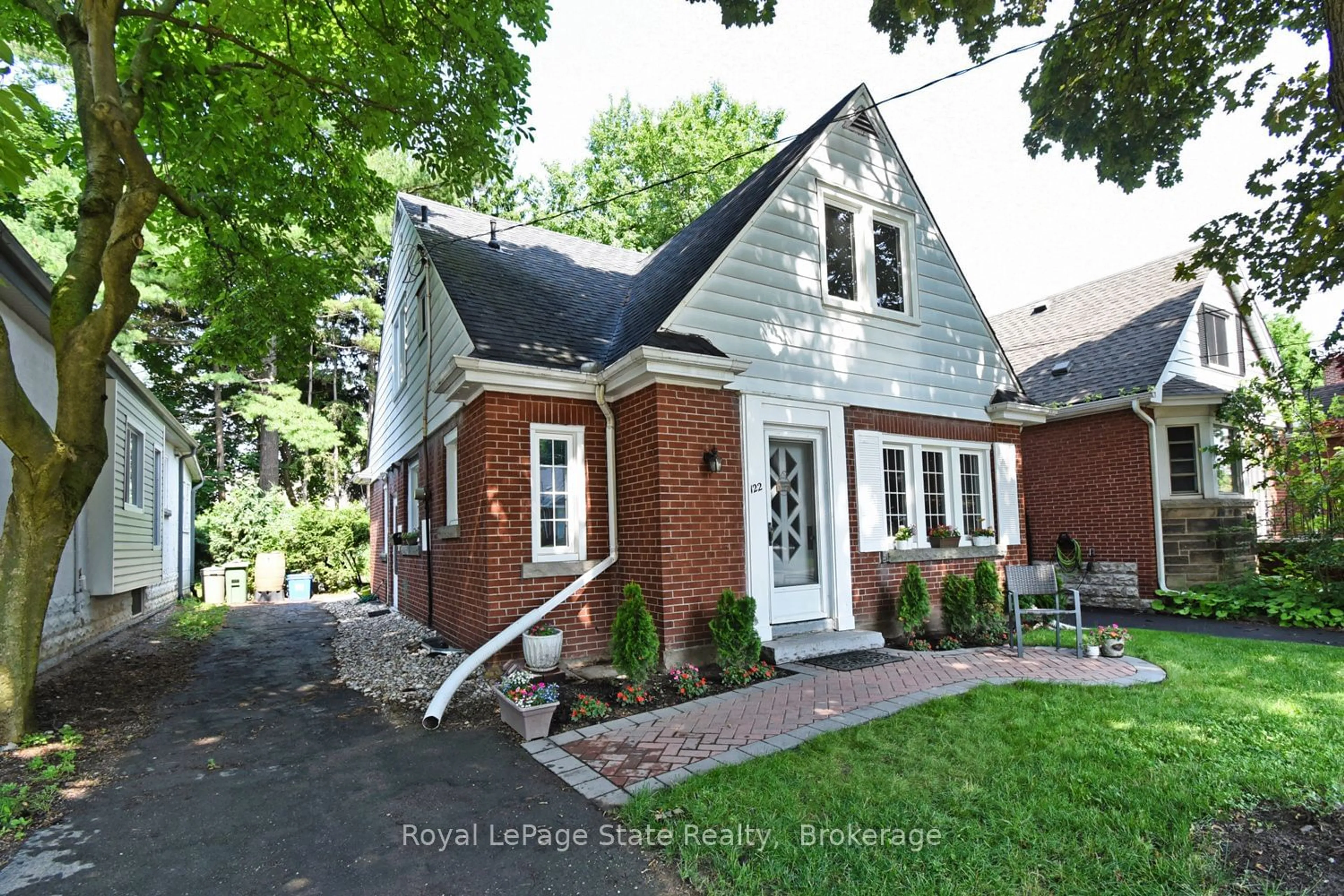 Home with brick exterior material for 122 Haddon Ave, Hamilton Ontario L8S 1X8