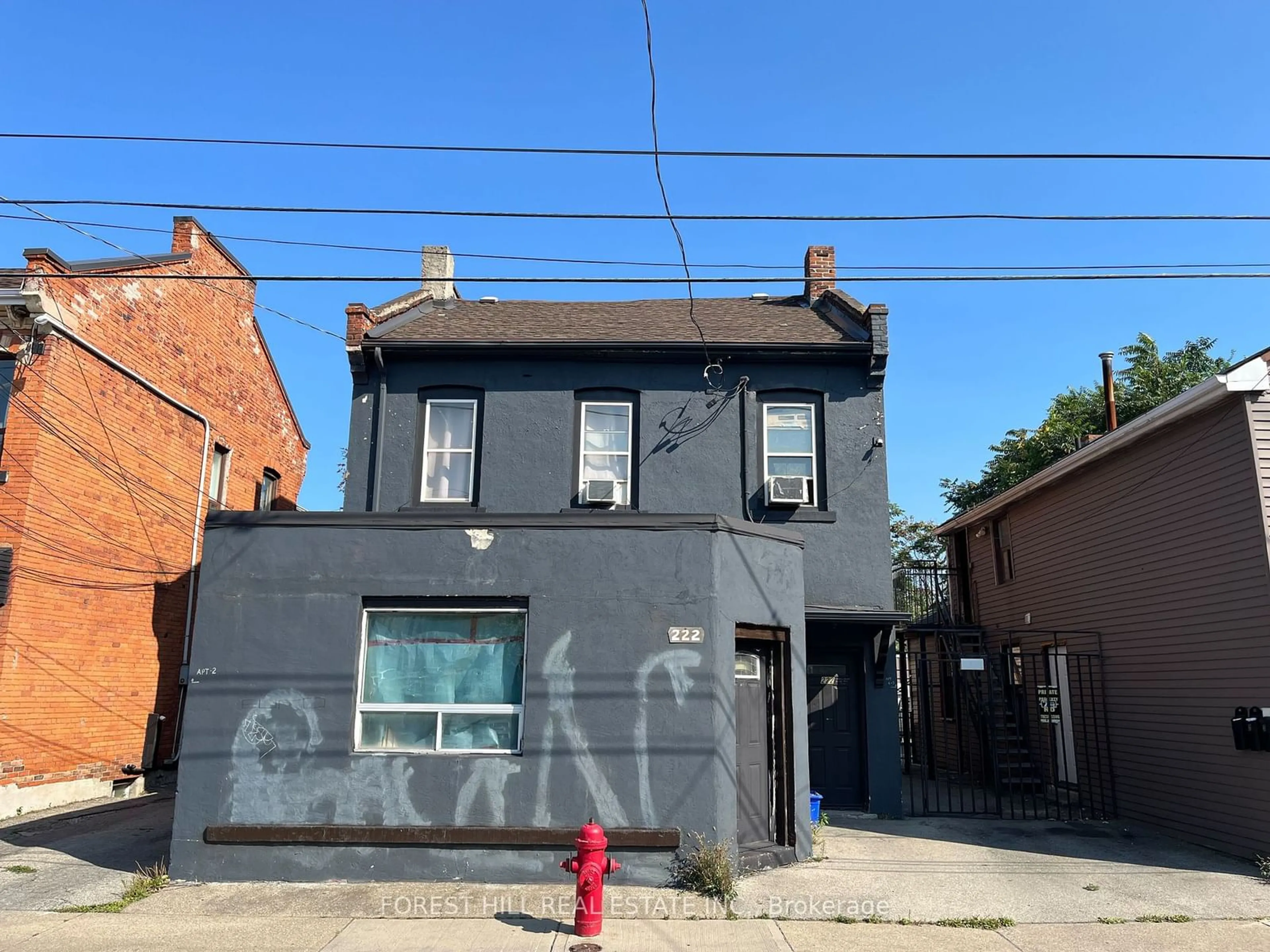 Frontside or backside of a home for 218-222 John St, Hamilton Ontario L8L 4P5