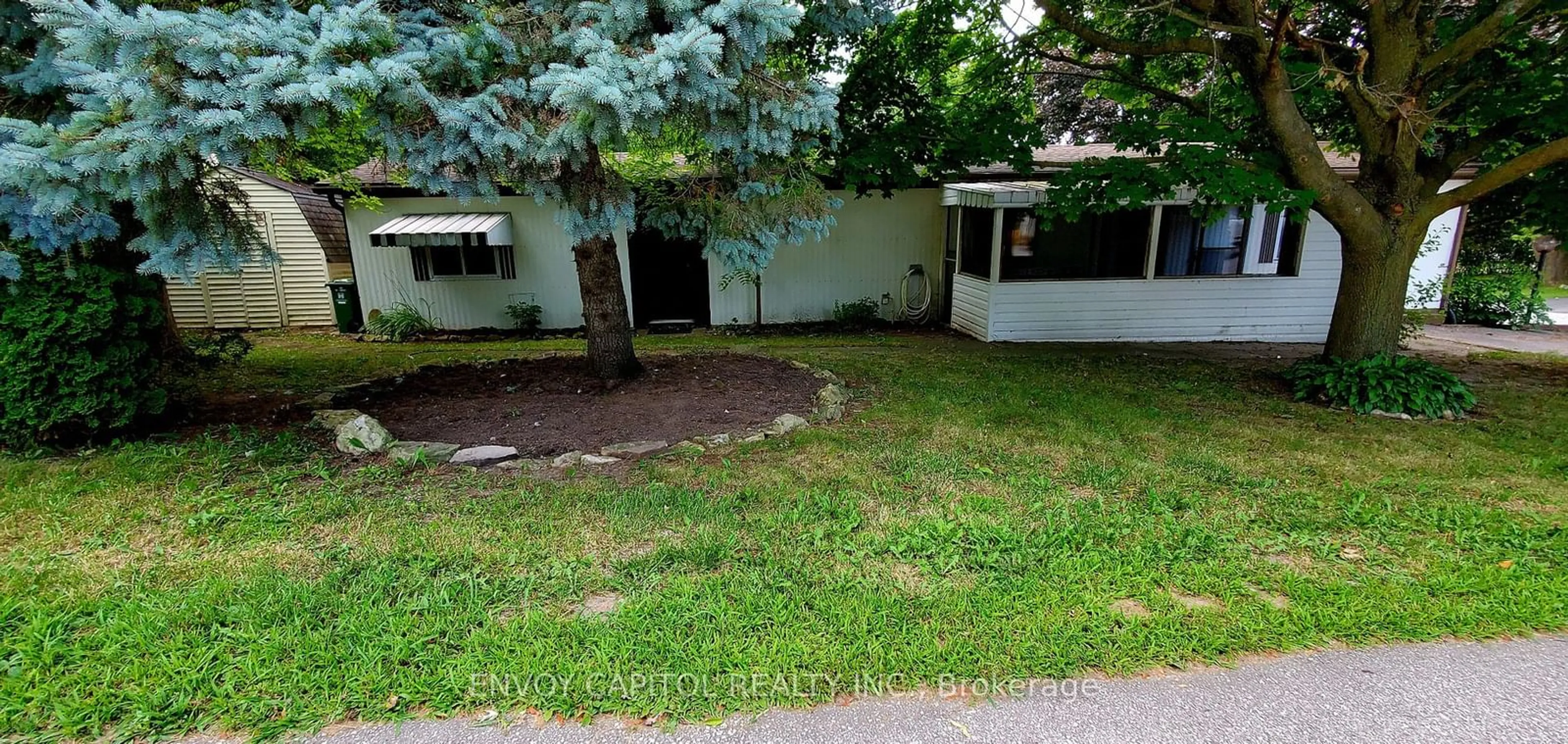 Frontside or backside of a home, the fenced backyard for 105 Maple Cres, Hamilton Ontario N0B 2J0