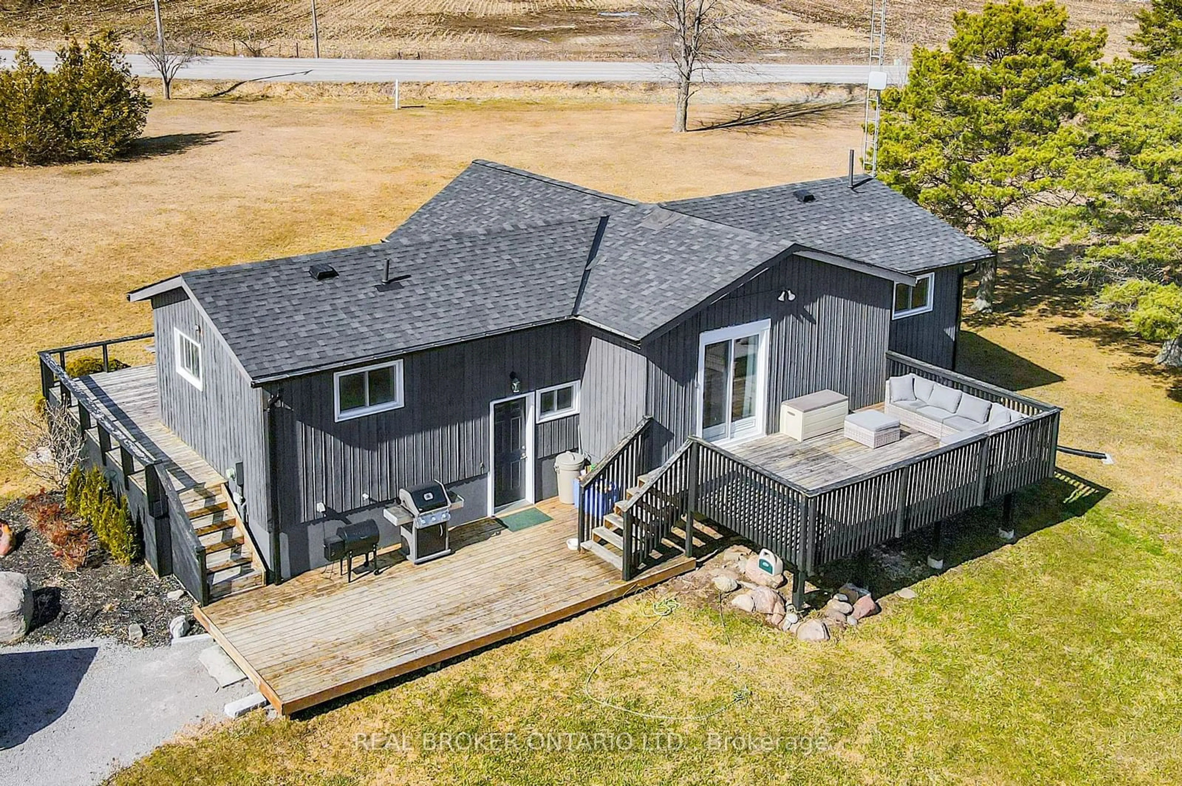 Frontside or backside of a home, the fenced backyard for 7 Port Hoover Rd, Kawartha Lakes Ontario K0M 2C0