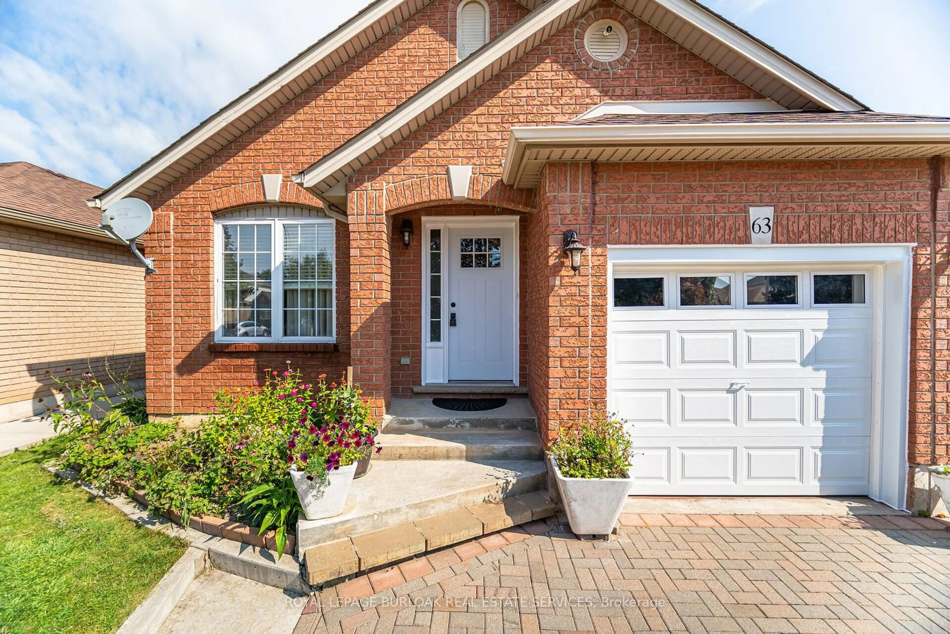 Home with brick exterior material for 63 Hillgarden Dr, Hamilton Ontario L8J 3R3