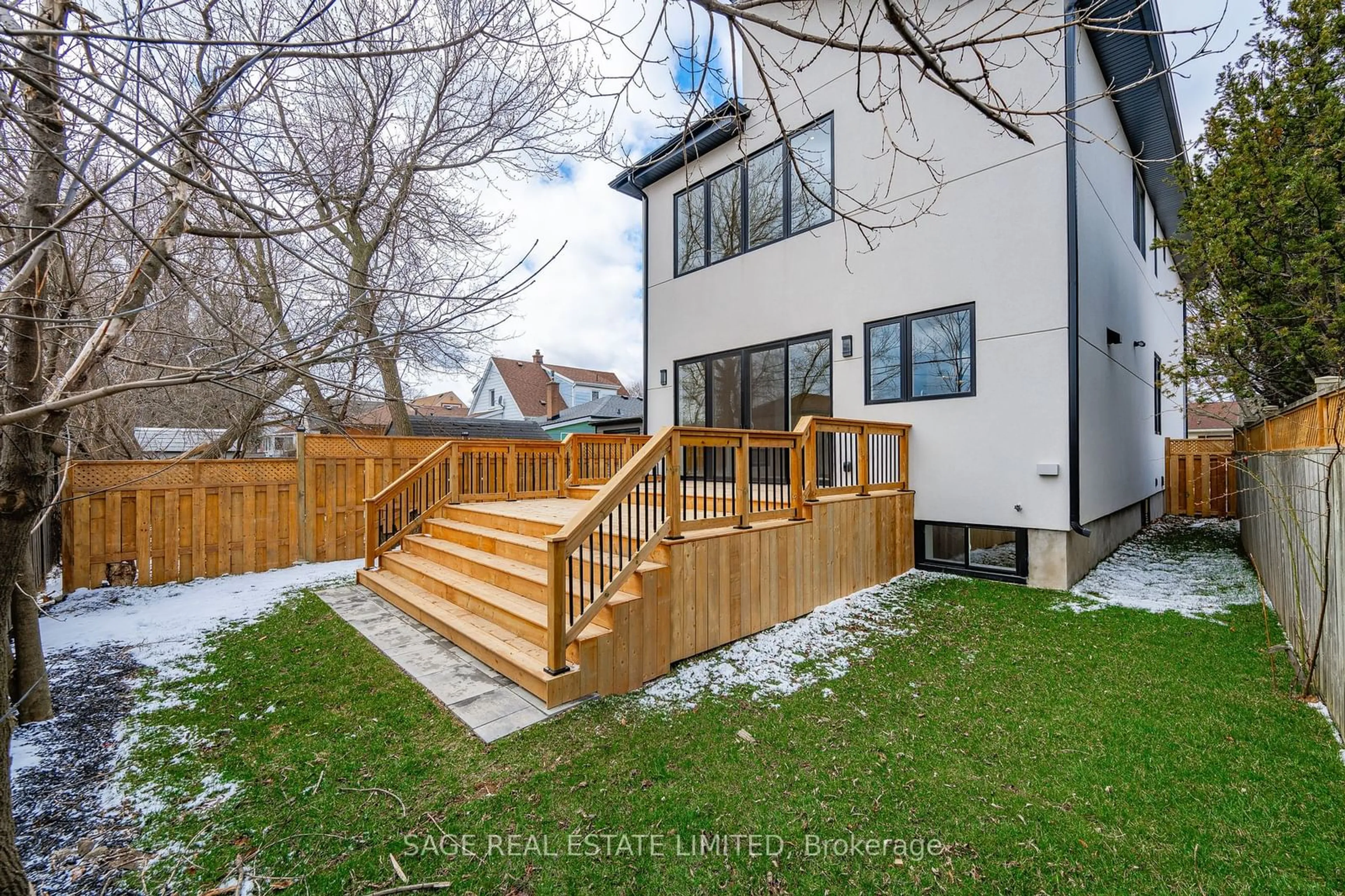 Frontside or backside of a home, the fenced backyard for 25 Shadyside Ave, Hamilton Ontario L8V 3E2