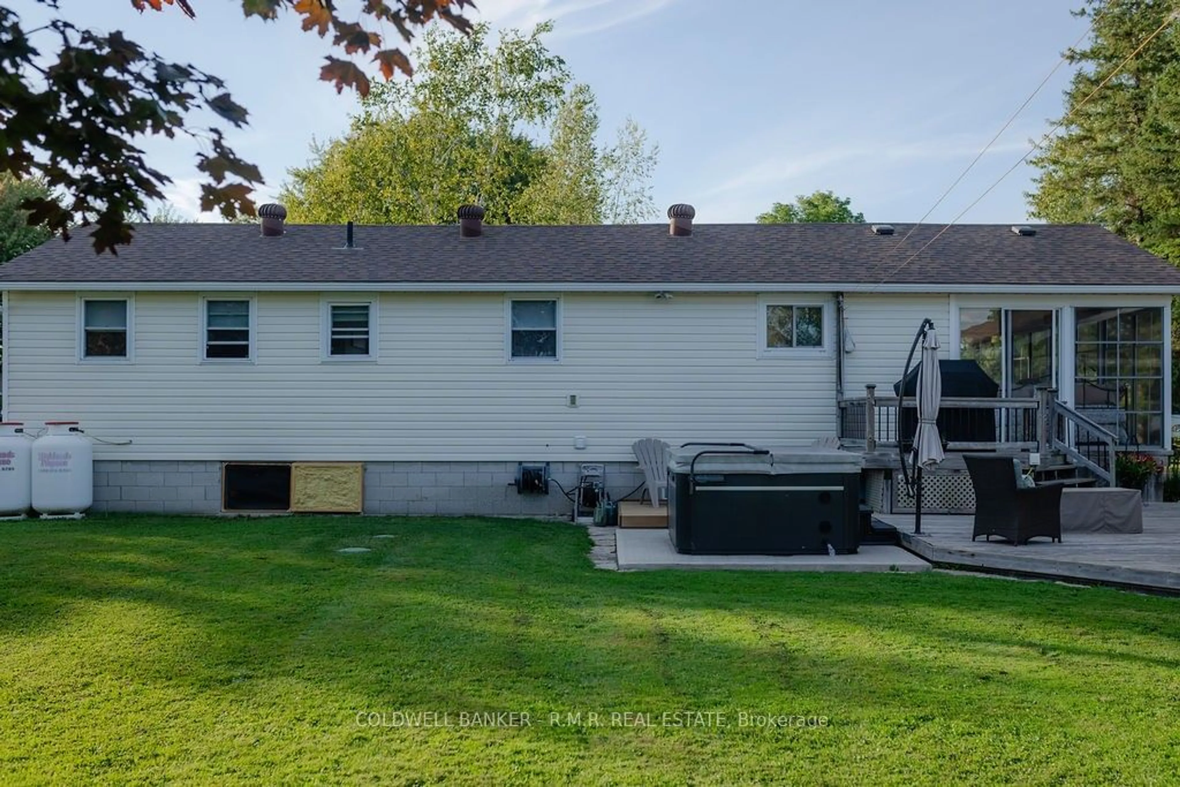 Frontside or backside of a home, the fenced backyard for 84 Driftwood Shores Rd, Kawartha Lakes Ontario K0M 2B0