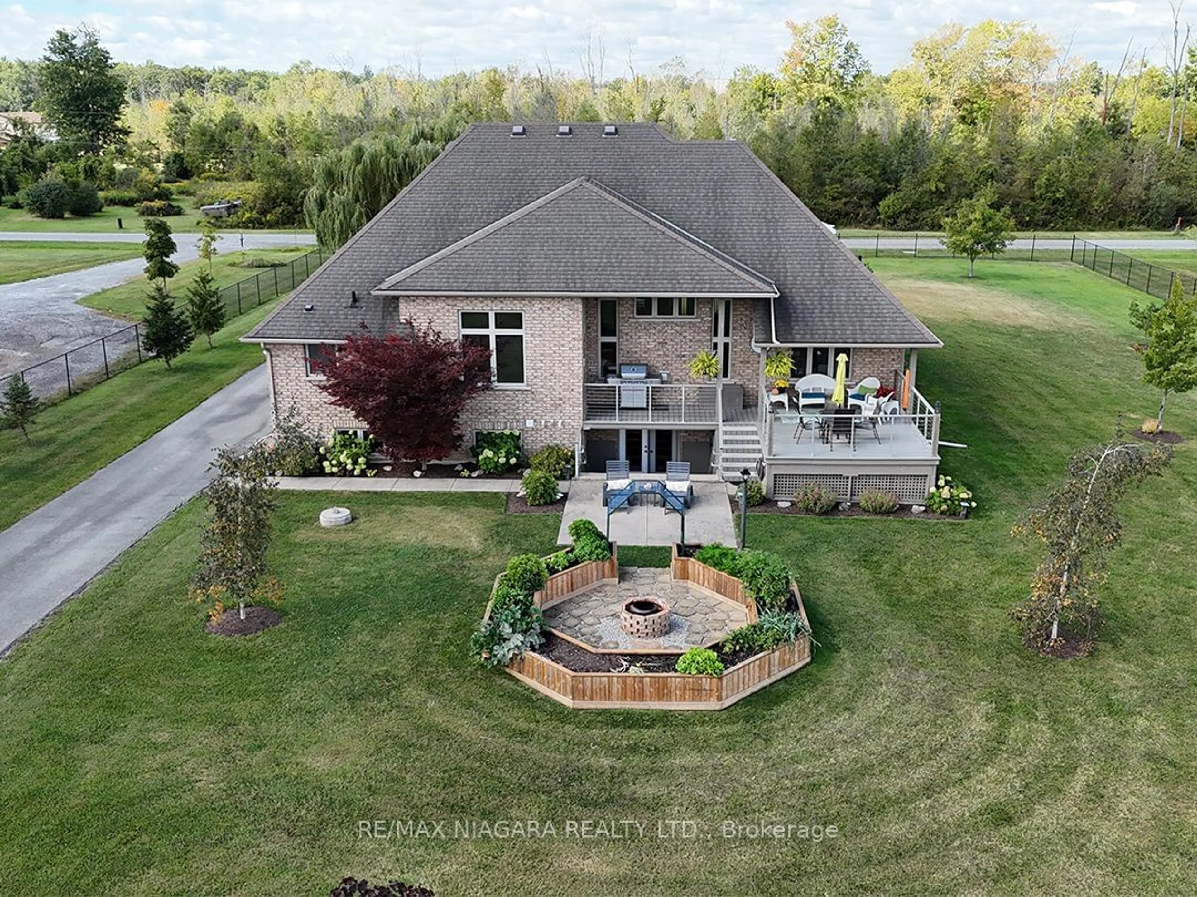 Frontside or backside of a home, the fenced backyard for 20219 Youngs Rd, Wainfleet Ontario L3K 5V4