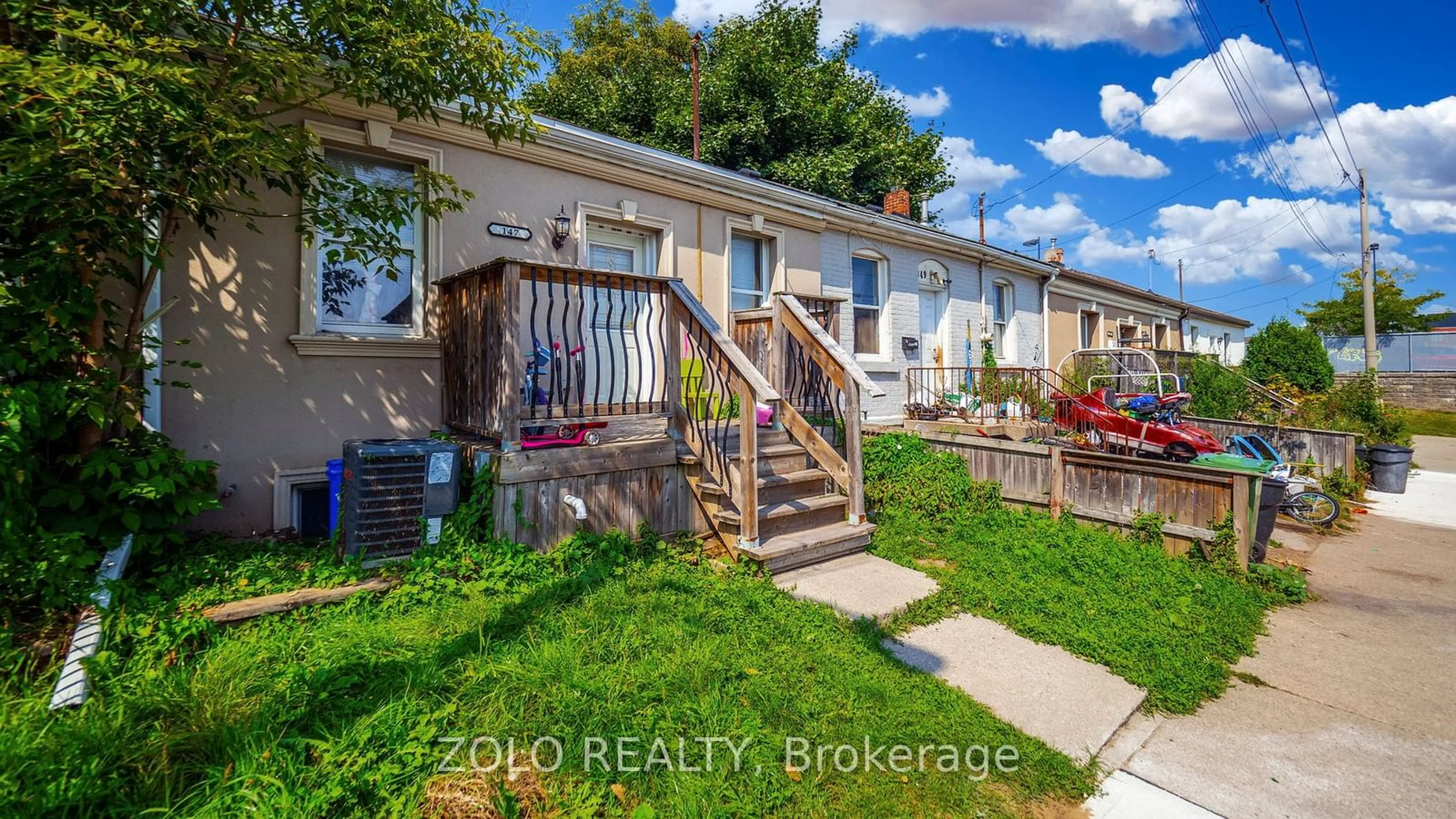 Frontside or backside of a home, the fenced backyard for 147 Cathcart St, Hamilton Ontario L8L 5A3