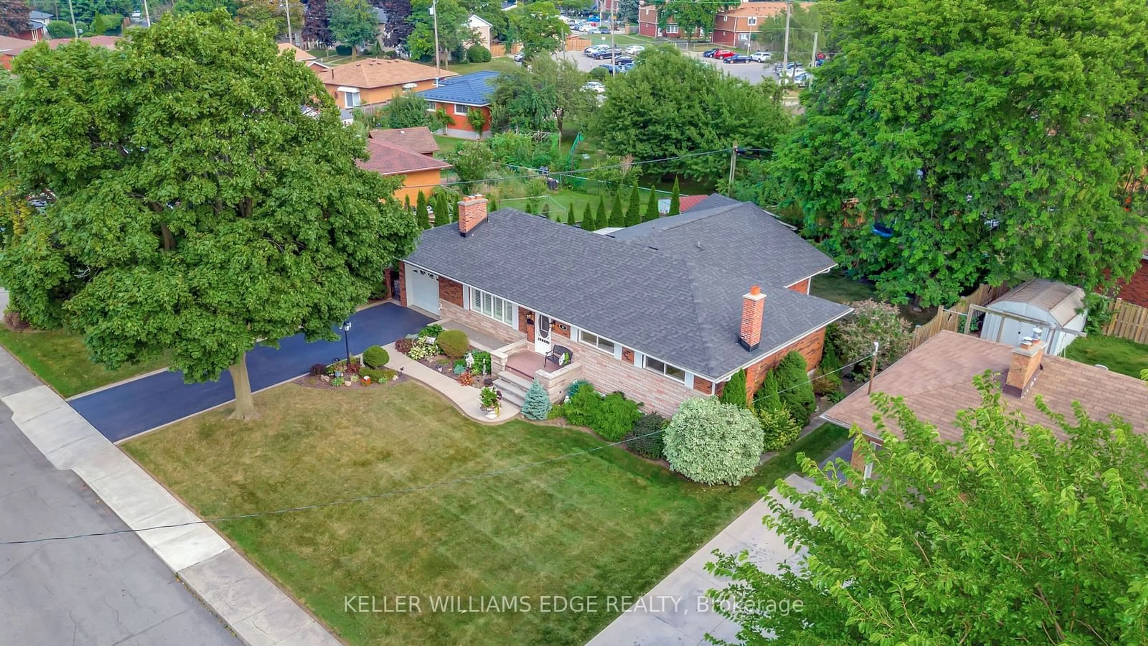 Frontside or backside of a home, the fenced backyard for 32 Old Orchard Dr, Hamilton Ontario L8E 1G2