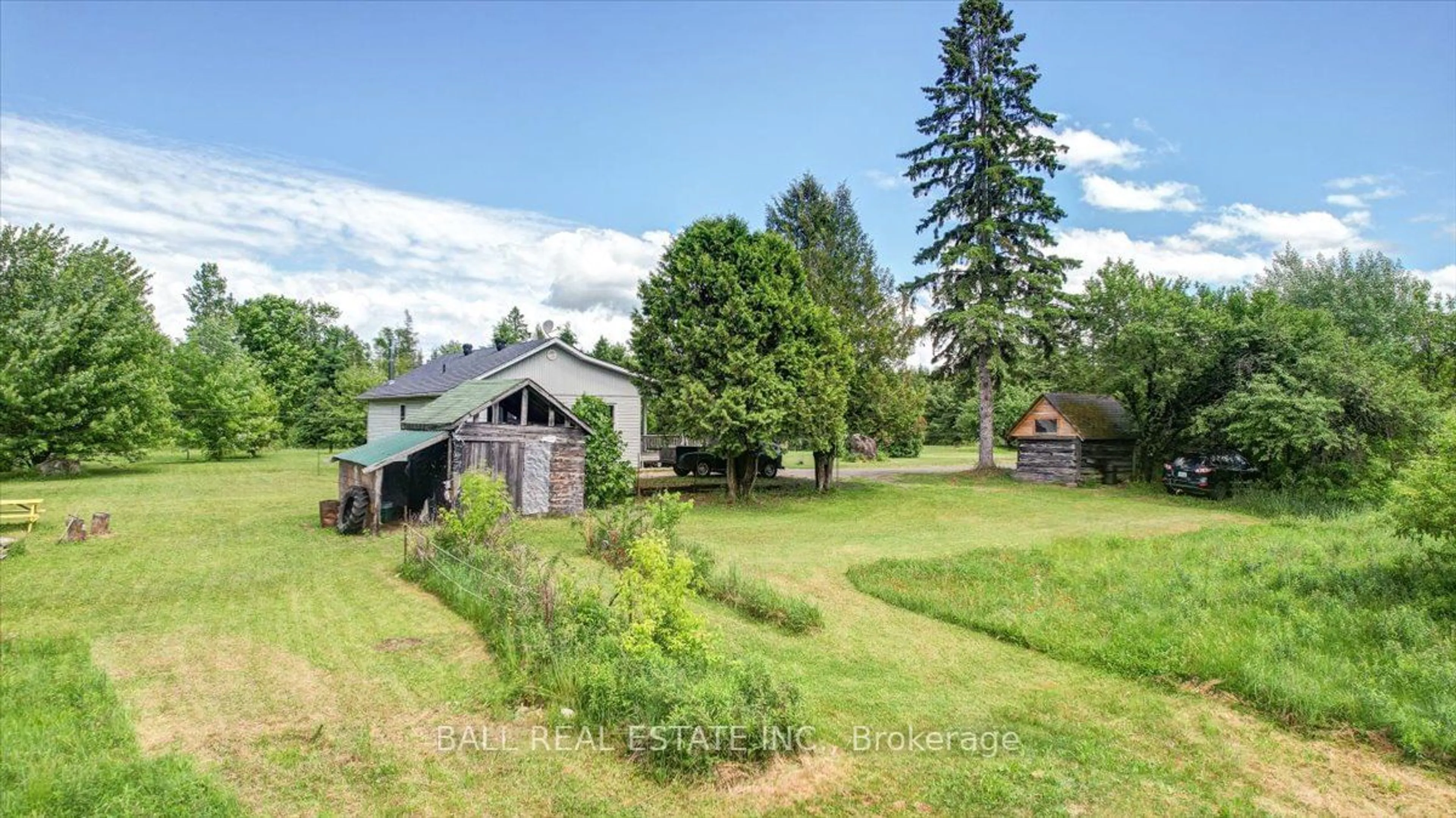 Frontside or backside of a home, the fenced backyard for 384 Scott Line Rd, Bancroft Ontario K0L 2S0