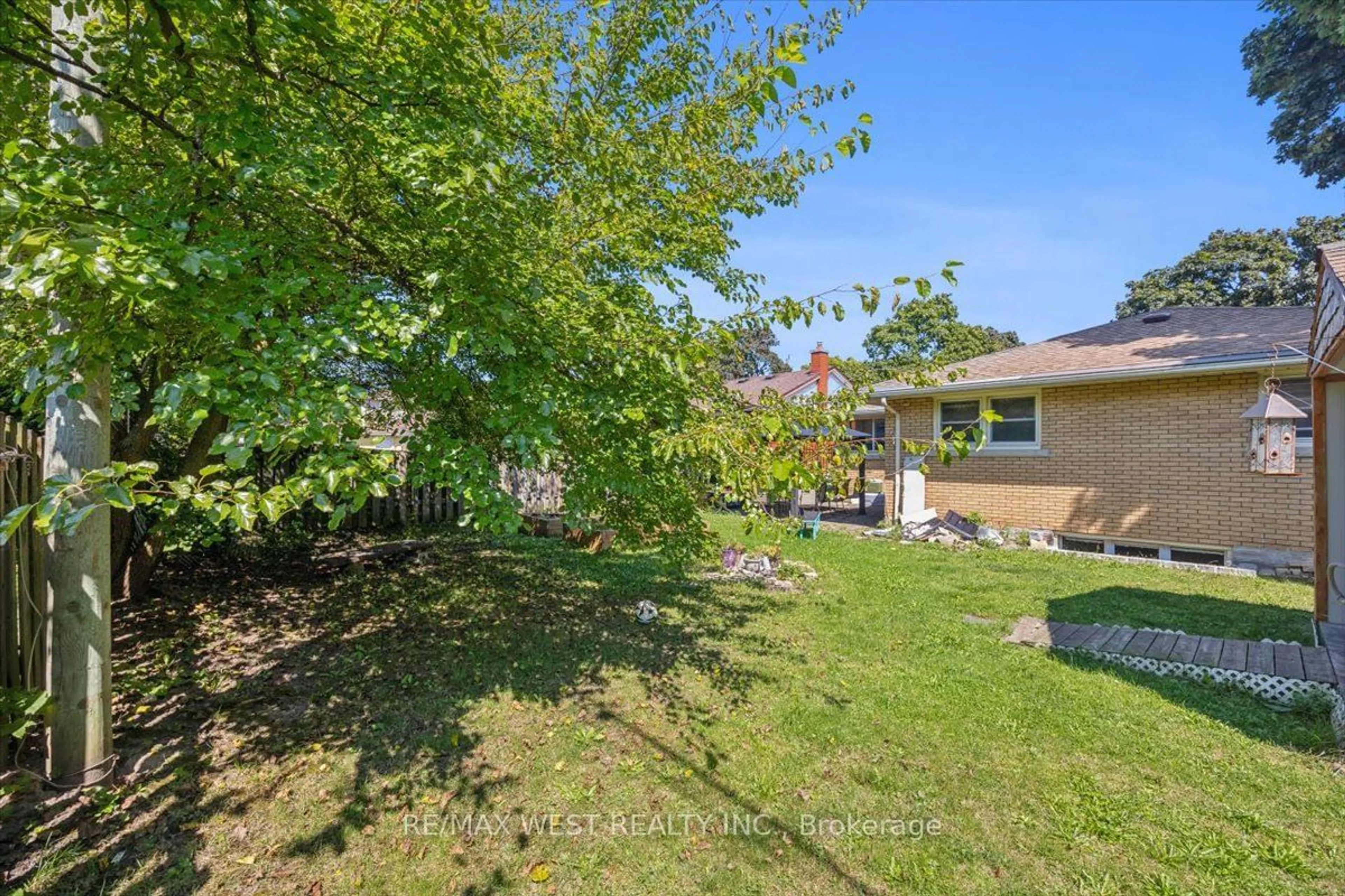 Frontside or backside of a home, the fenced backyard for 59 Maywood Rd, Kitchener Ontario N2C 2A2