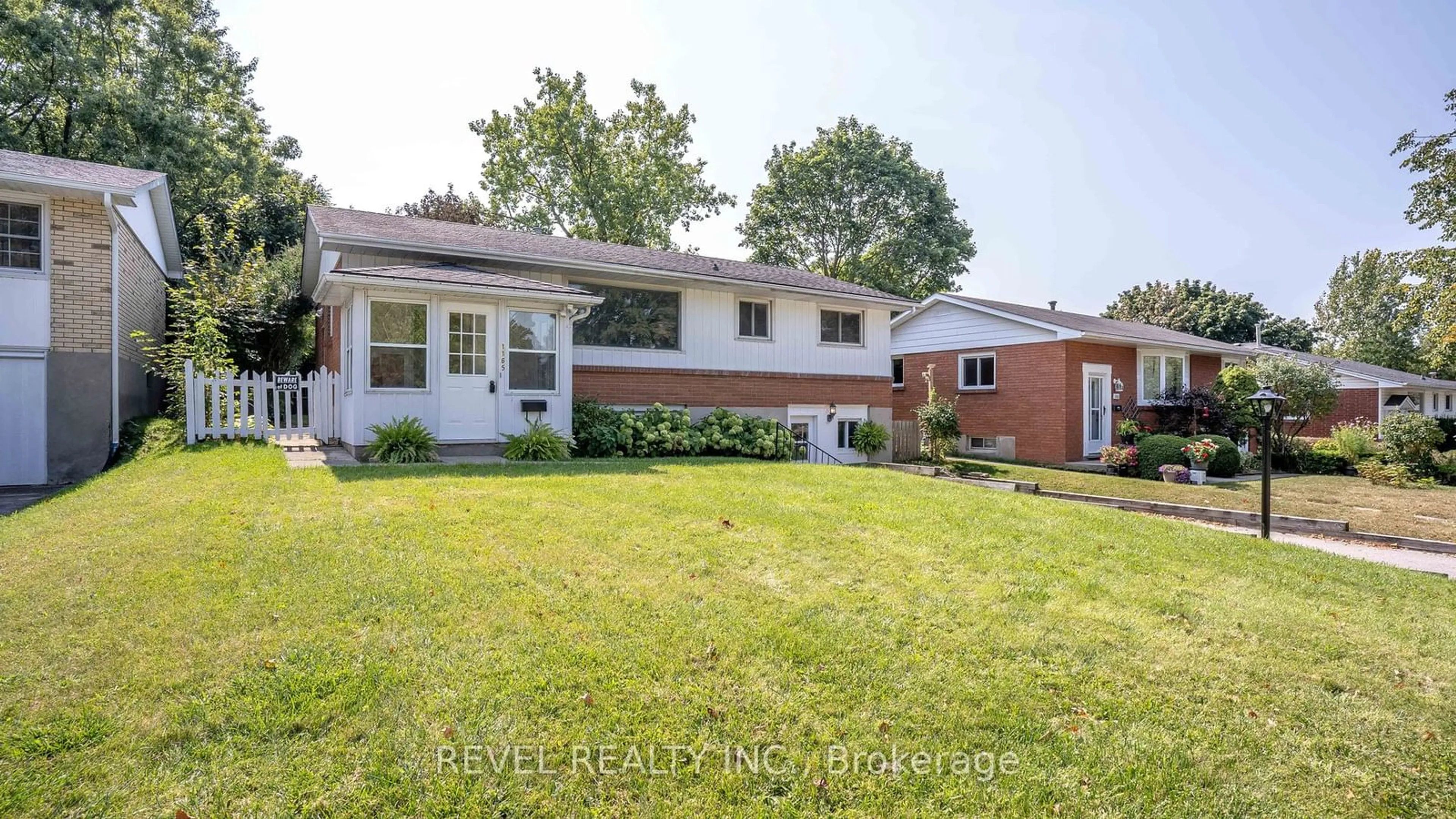 Frontside or backside of a home, the fenced backyard for 1165 Melsandra Ave, London Ontario N5Y 4N8