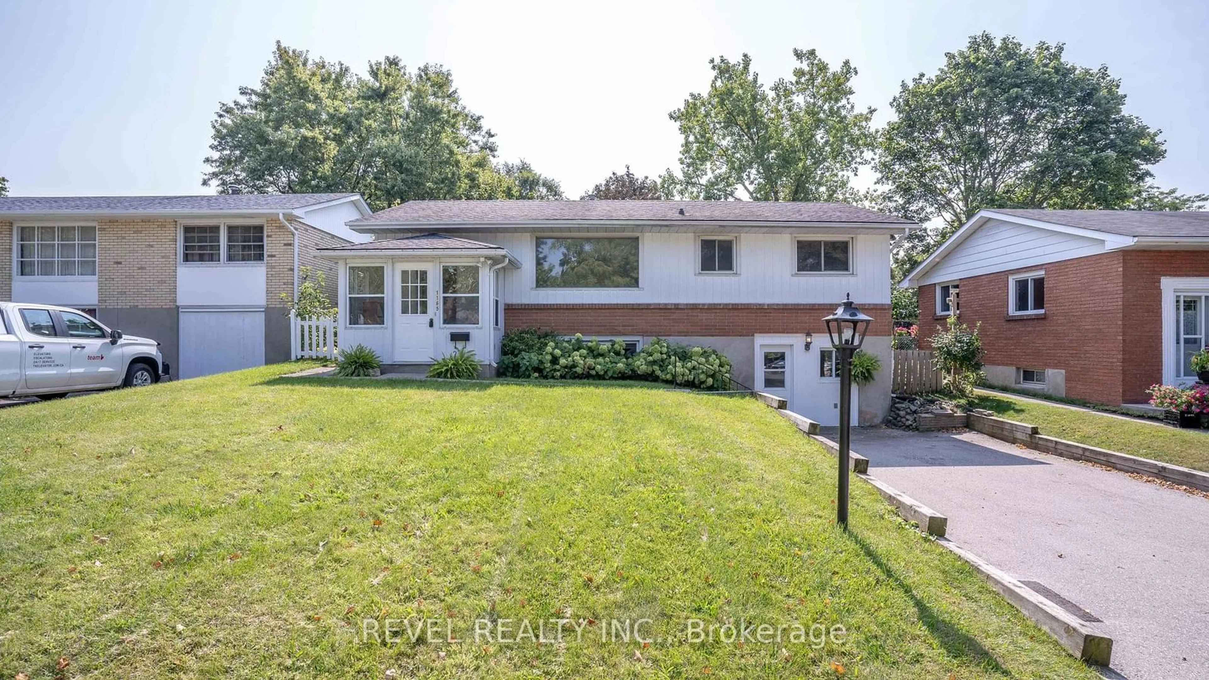 Frontside or backside of a home, the fenced backyard for 1165 Melsandra Ave, London Ontario N5Y 4N8