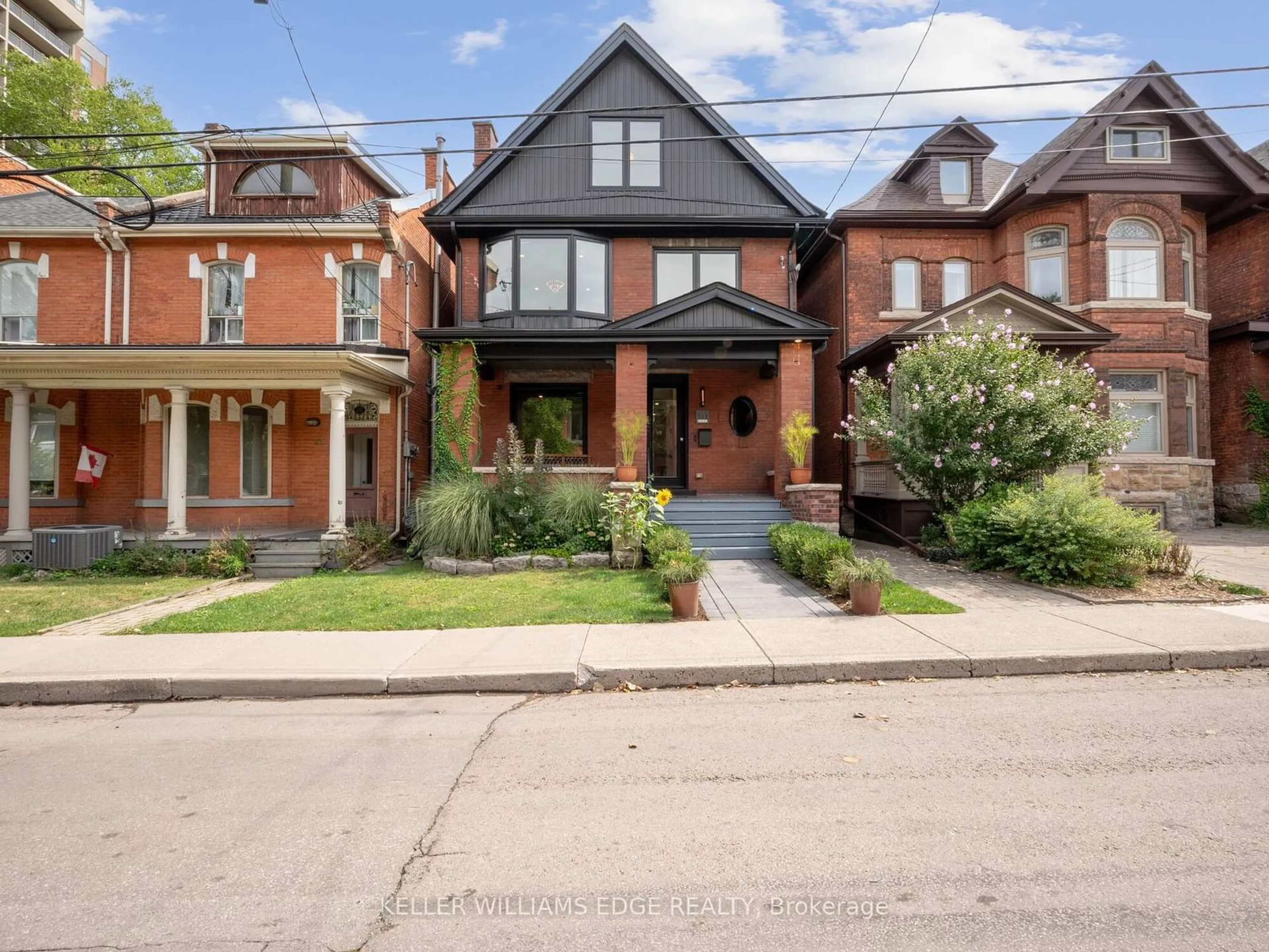 Frontside or backside of a home, the street view for 213 Caroline St, Hamilton Ontario L8P 3L5