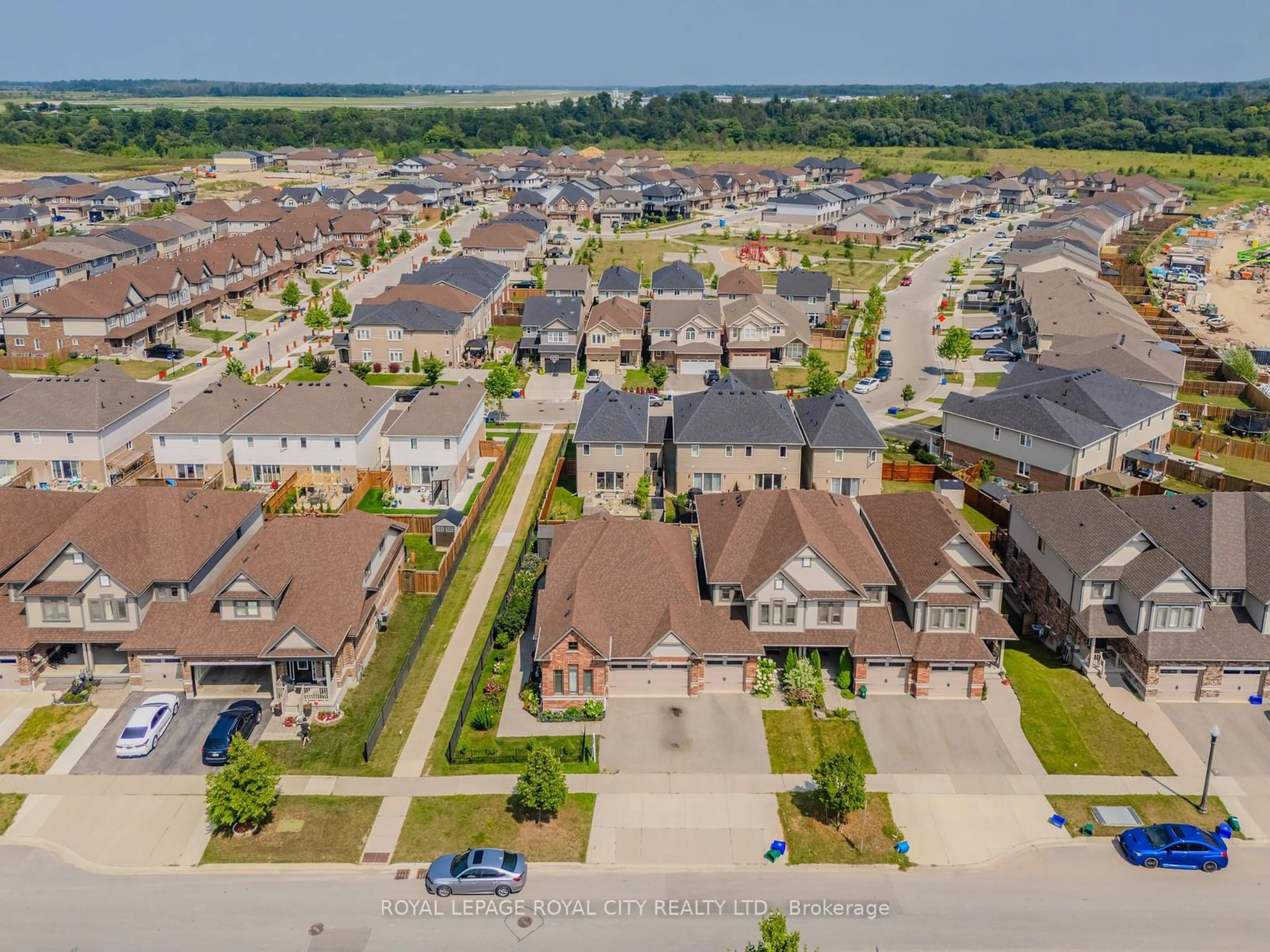 Frontside or backside of a home, the street view for 205 Eden Oak Tr, Kitchener Ontario N2A 0H6