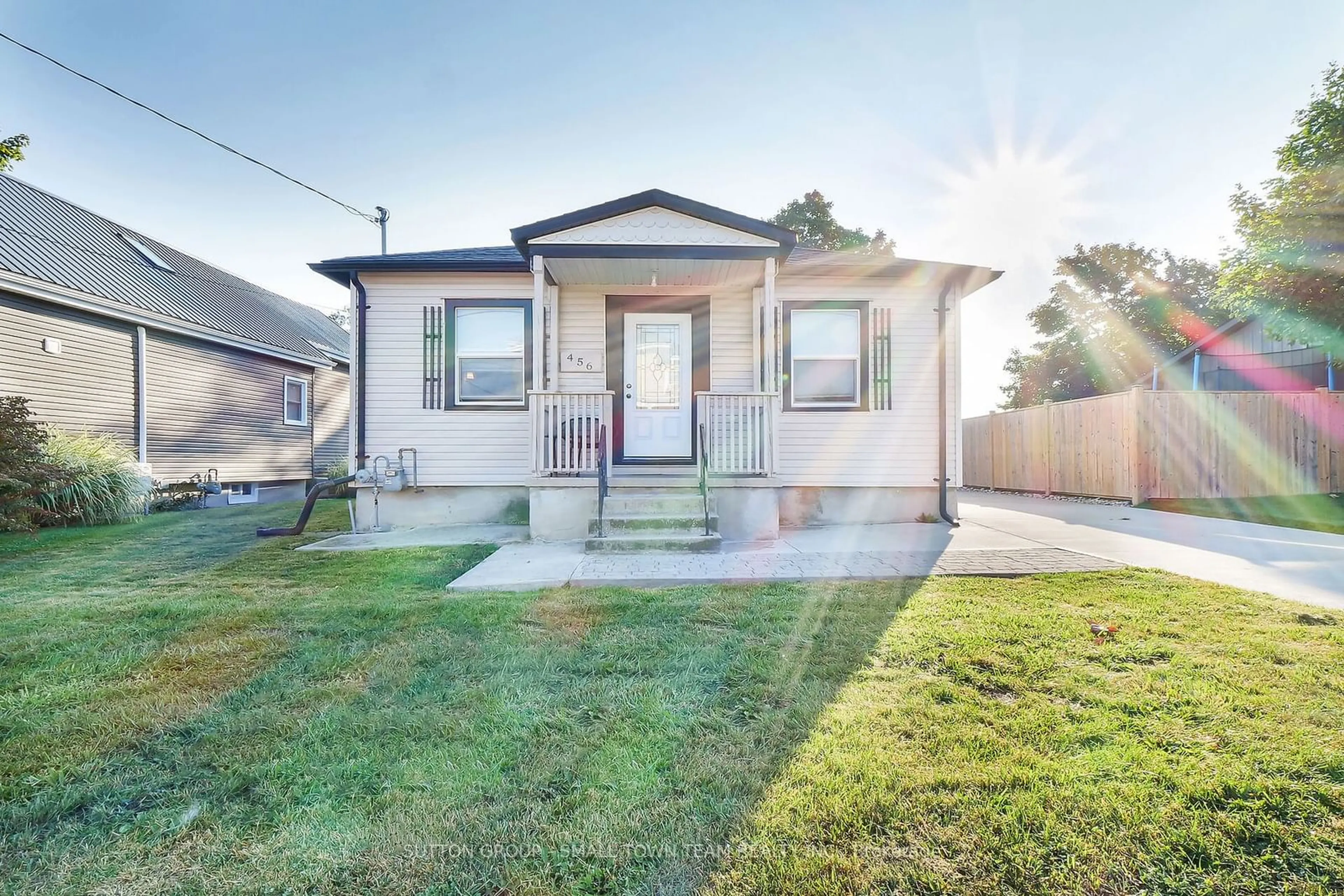 Frontside or backside of a home, the fenced backyard for 456 Andrew St, South Huron Ontario N0M 1S1