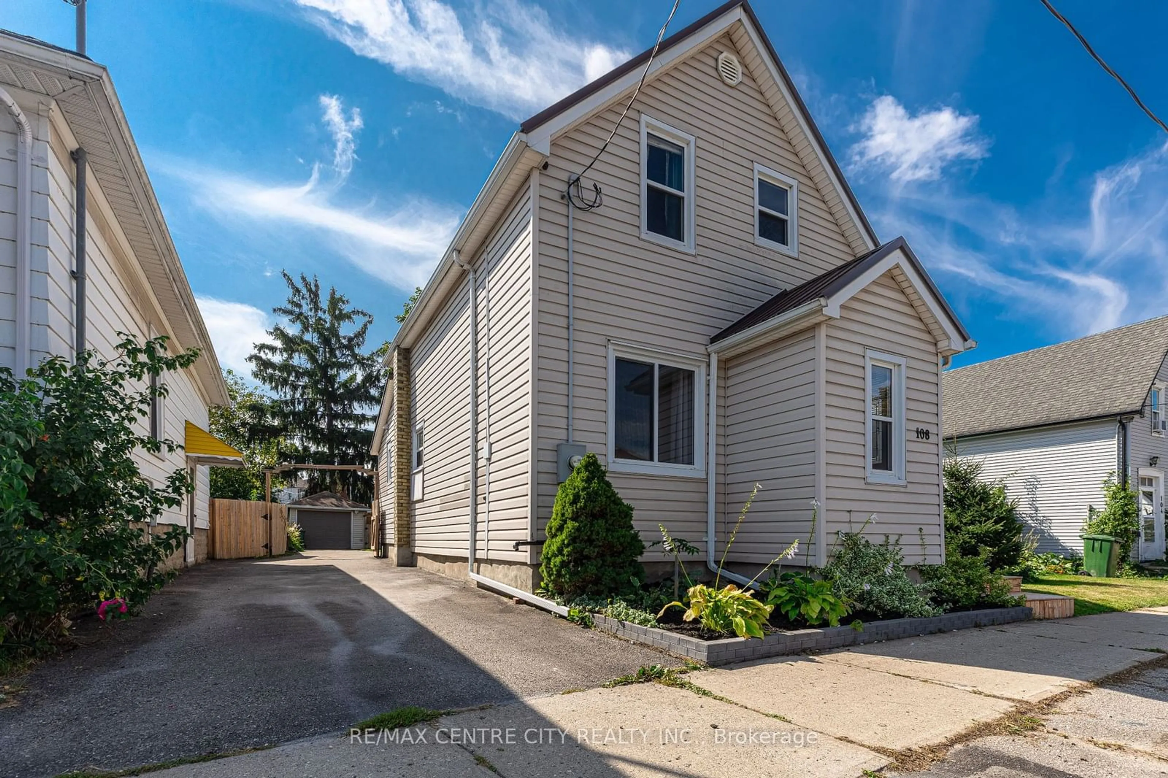 A pic from exterior of the house or condo, the fenced backyard for 108 Scott St, St. Thomas Ontario N5P 1L3