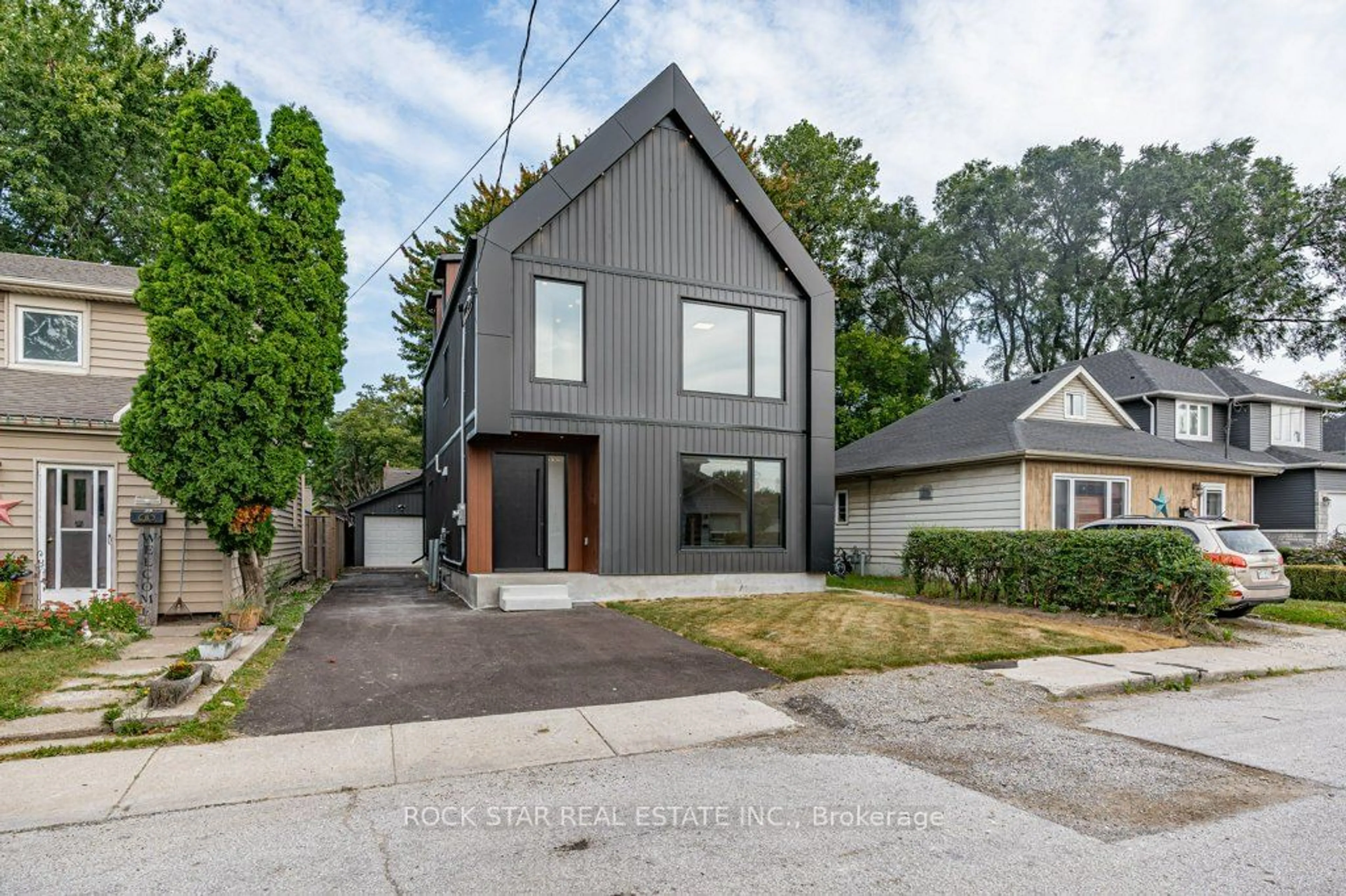 Frontside or backside of a home, the street view for 21 Clare Ave, Hamilton Ontario L8H 7C9