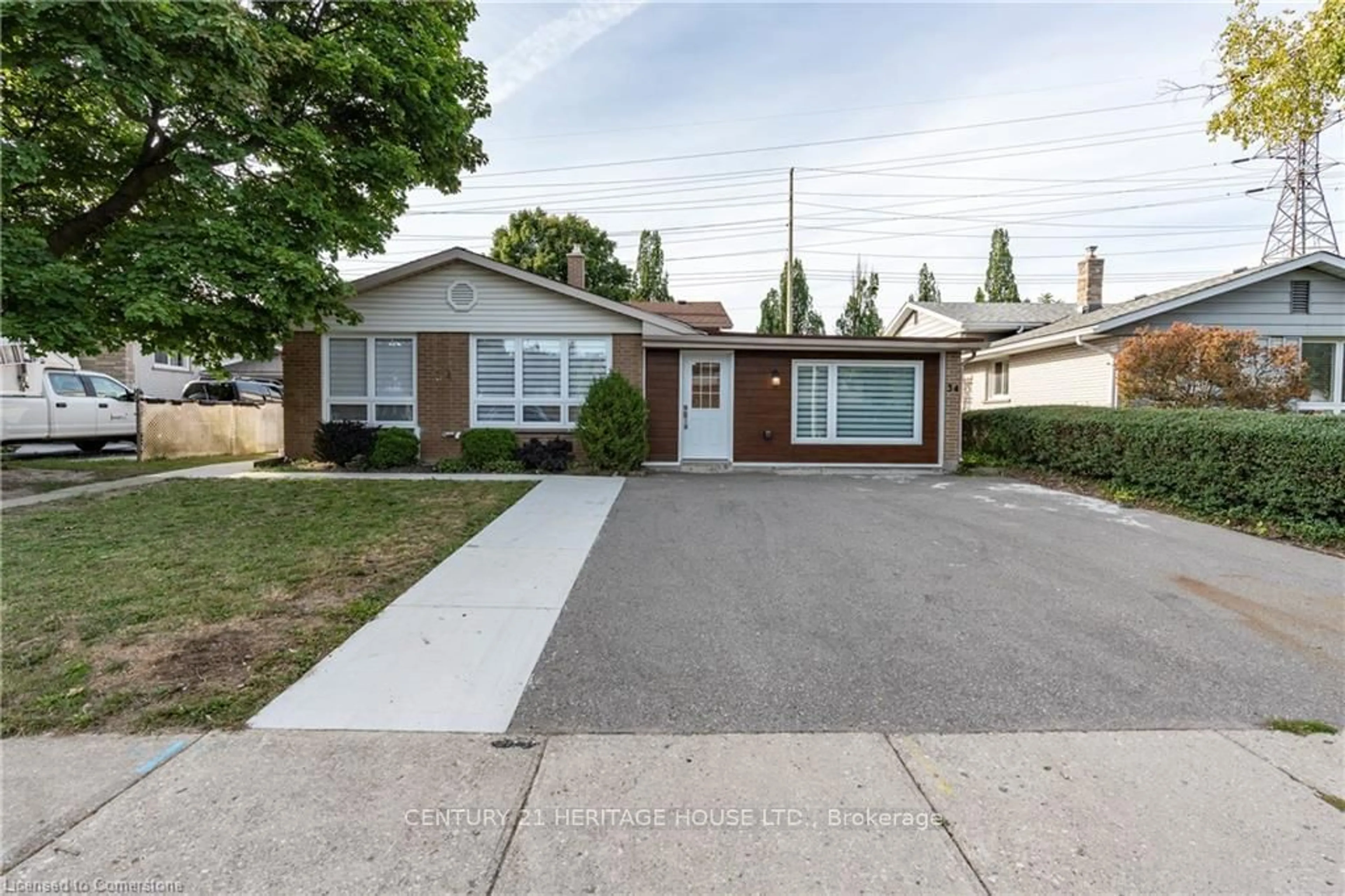 Frontside or backside of a home, the street view for 34 Dooley Dr, Kitchener Ontario N2A 1L4