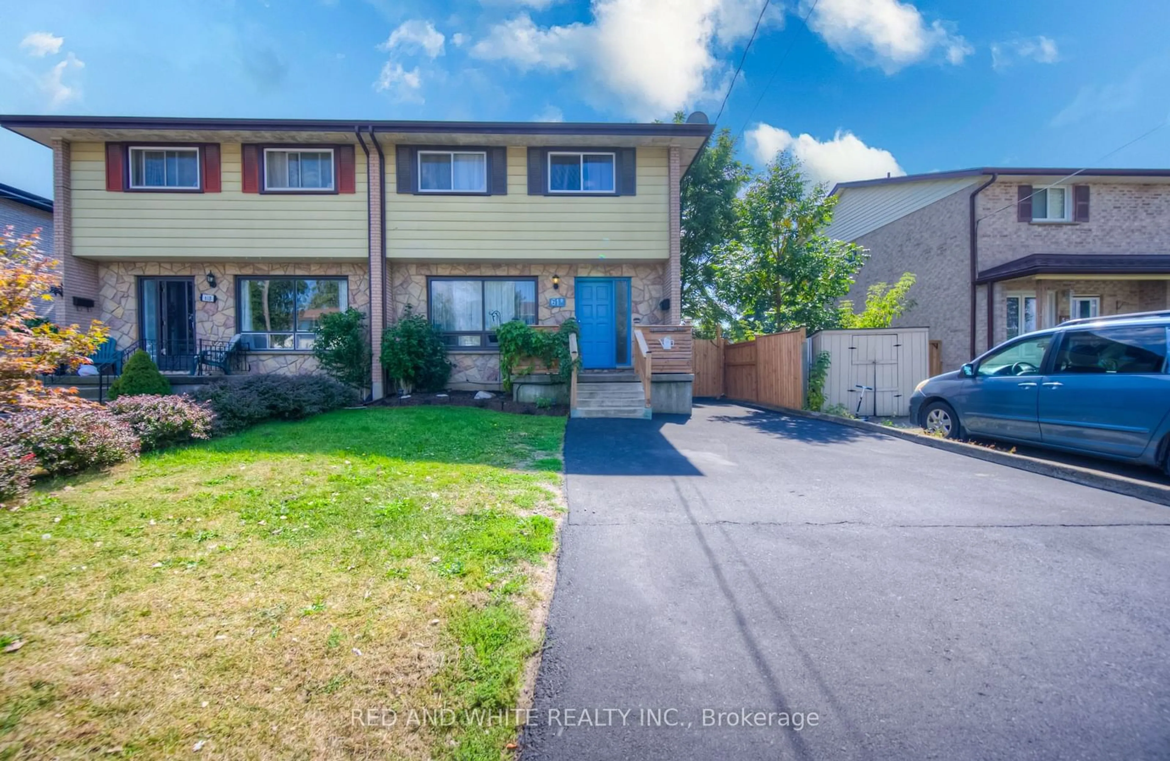 A pic from exterior of the house or condo, the fenced backyard for 61 Cumberland St #A, Brantford Ontario N3S 4P2