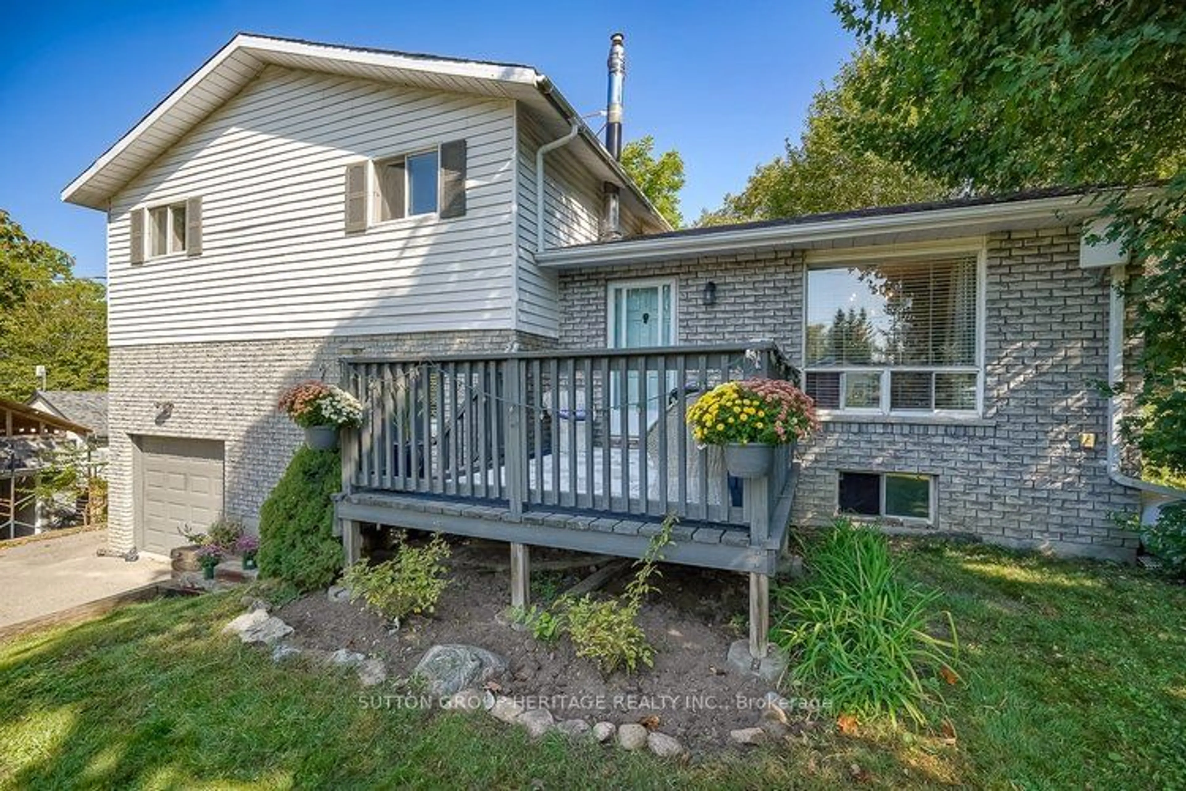 Frontside or backside of a home, the fenced backyard for 6 Lenal St, Kawartha Lakes Ontario K0M 1L0