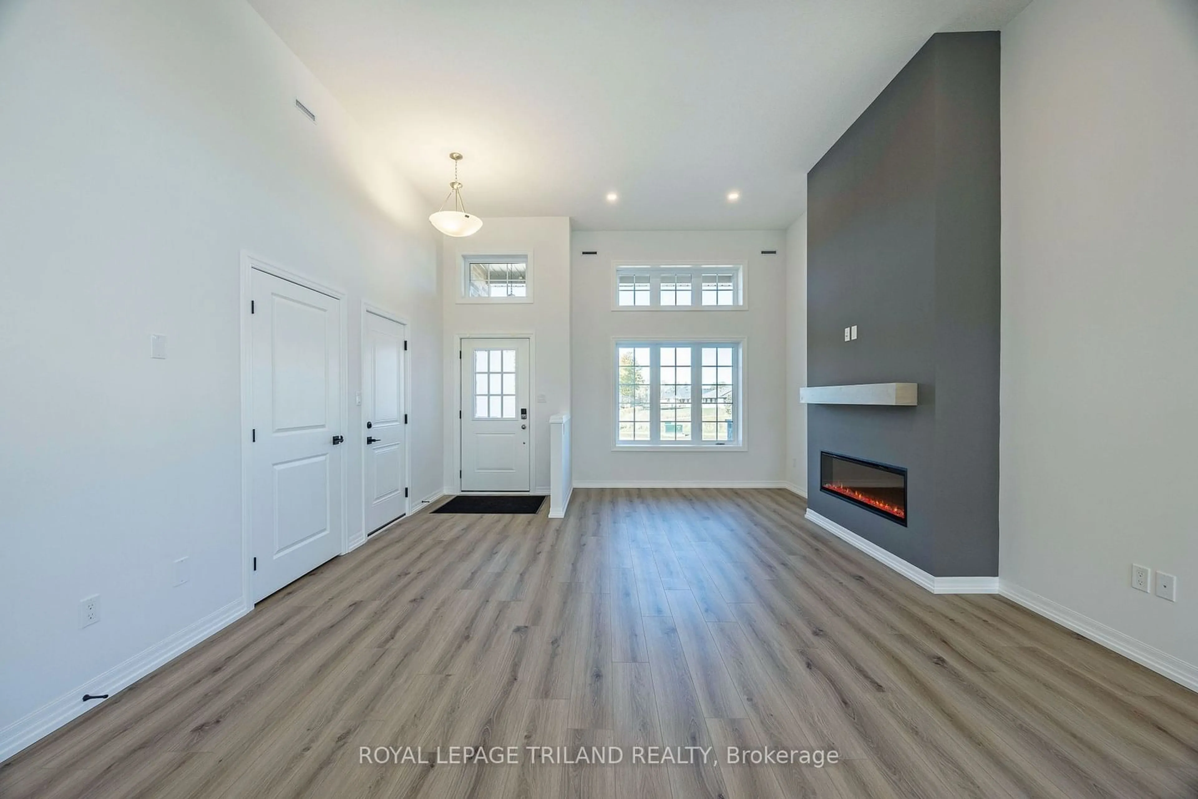 Indoor entryway, wood floors for 54 SNOWY OWL Tr, Central Elgin Ontario N5R 0M7