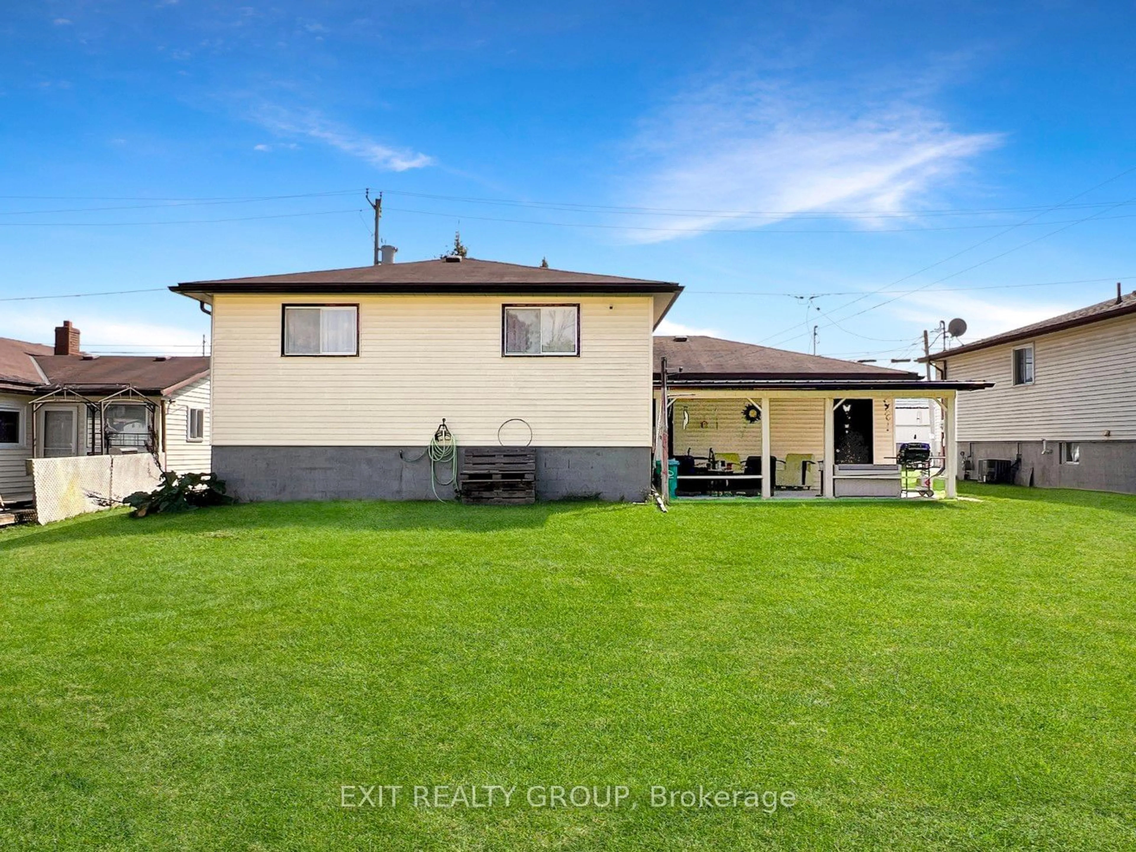 Frontside or backside of a home, the fenced backyard for 22 March St, Quinte West Ontario K0K 2C0