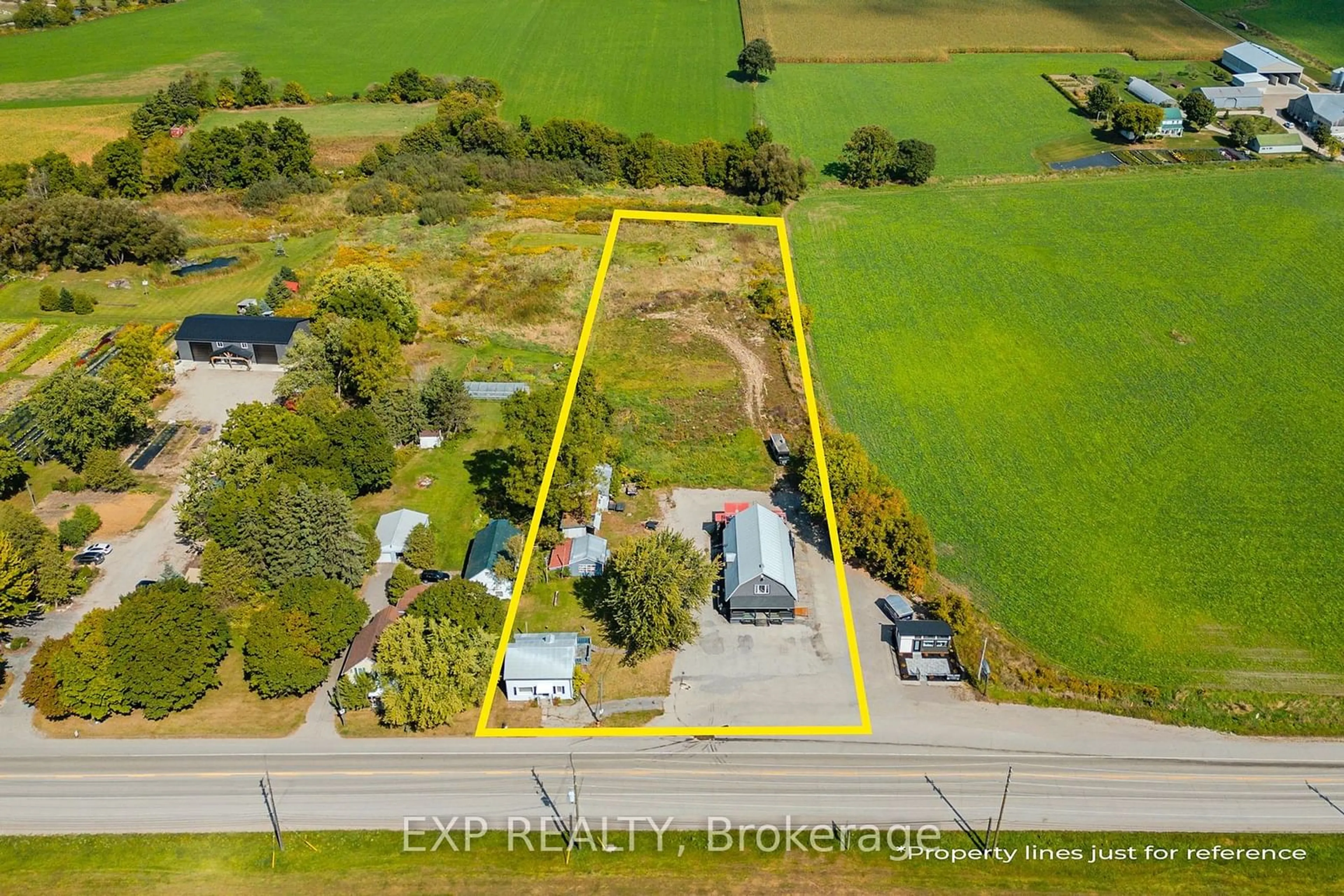 Frontside or backside of a home, the fenced backyard for 1221 Lobsinger Line, Woolwich Ontario N2J 4G8